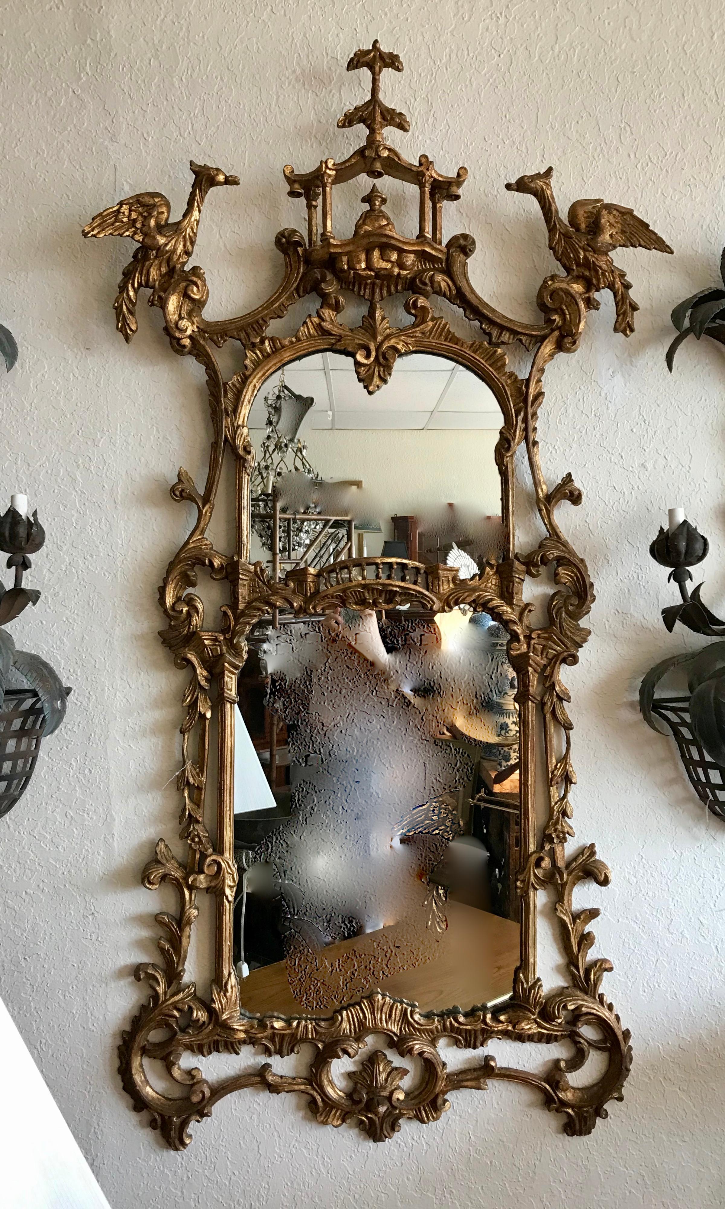 Superb and highly stylized - accented with carved figures of Hoho birds
The mirror is fashioned with both top and bottom sections.
The carvings are crisp and extensive. Fine gilding.
