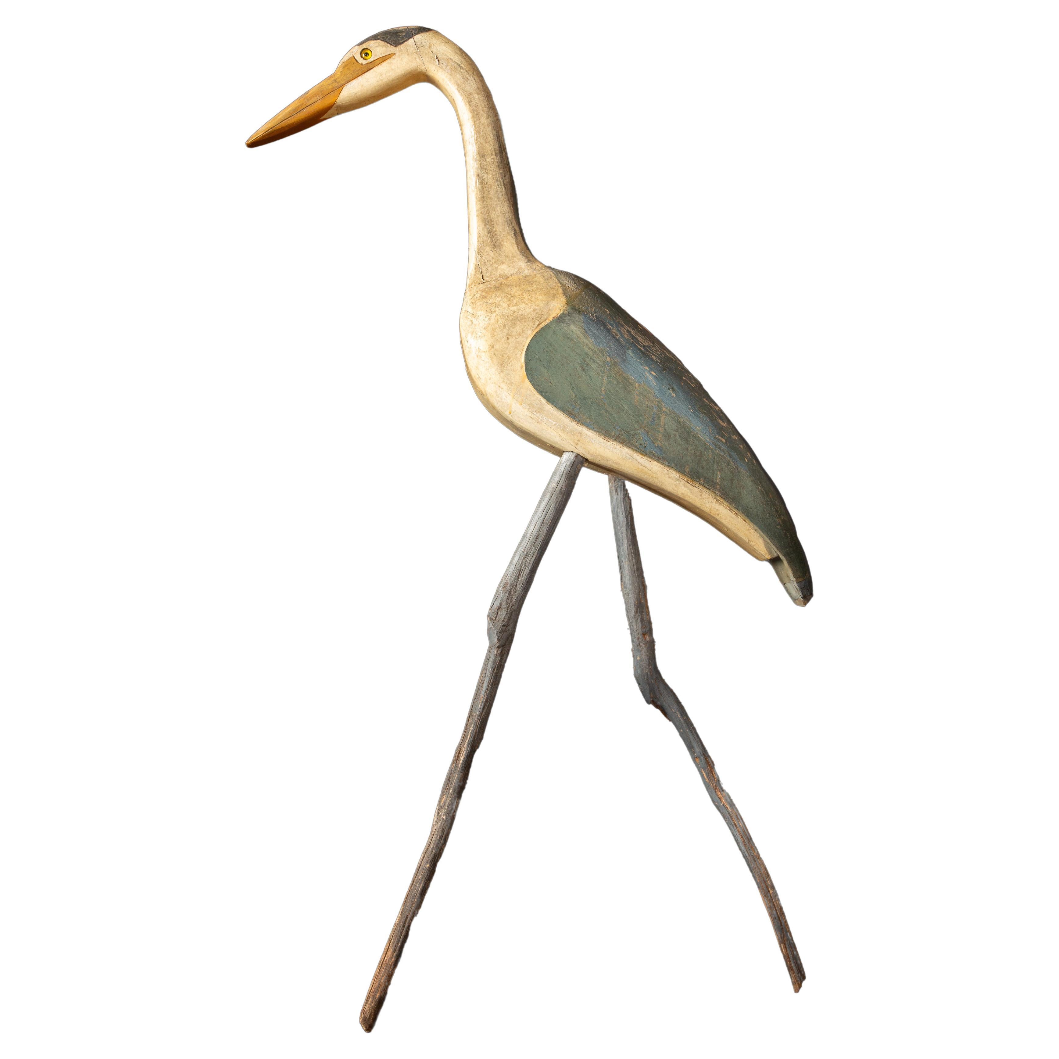 Tall Painted Carved Wood Folk Art Crane with Drift Wood Legs For Sale
