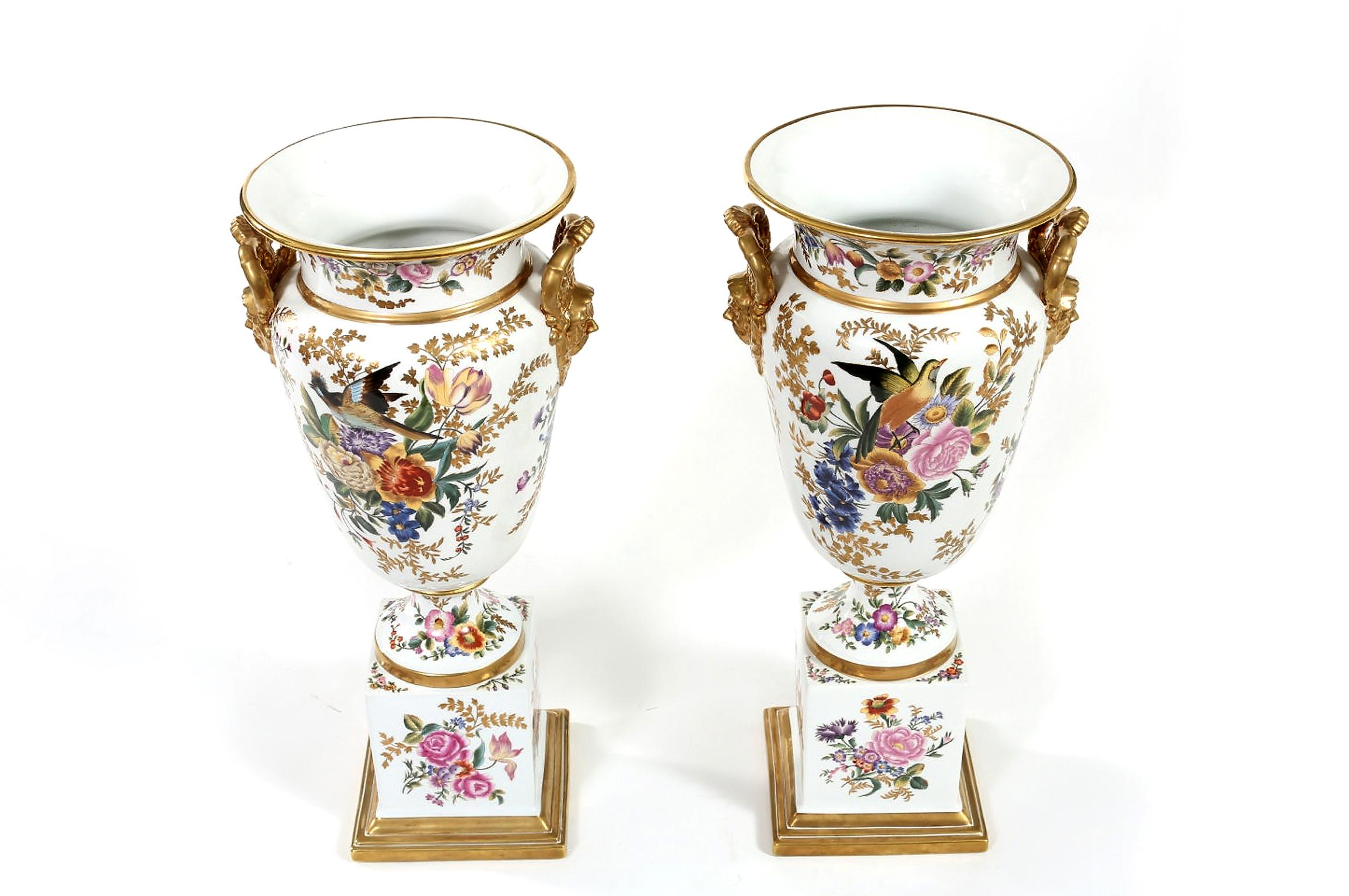 Tall pair of English porcelain decorative pieces / vases with hand painted gilt gold and exterior design details. Each vase is in great condition with minor wear consistent with age / use. Maker's march undersigned. Each one measures about 23 inches