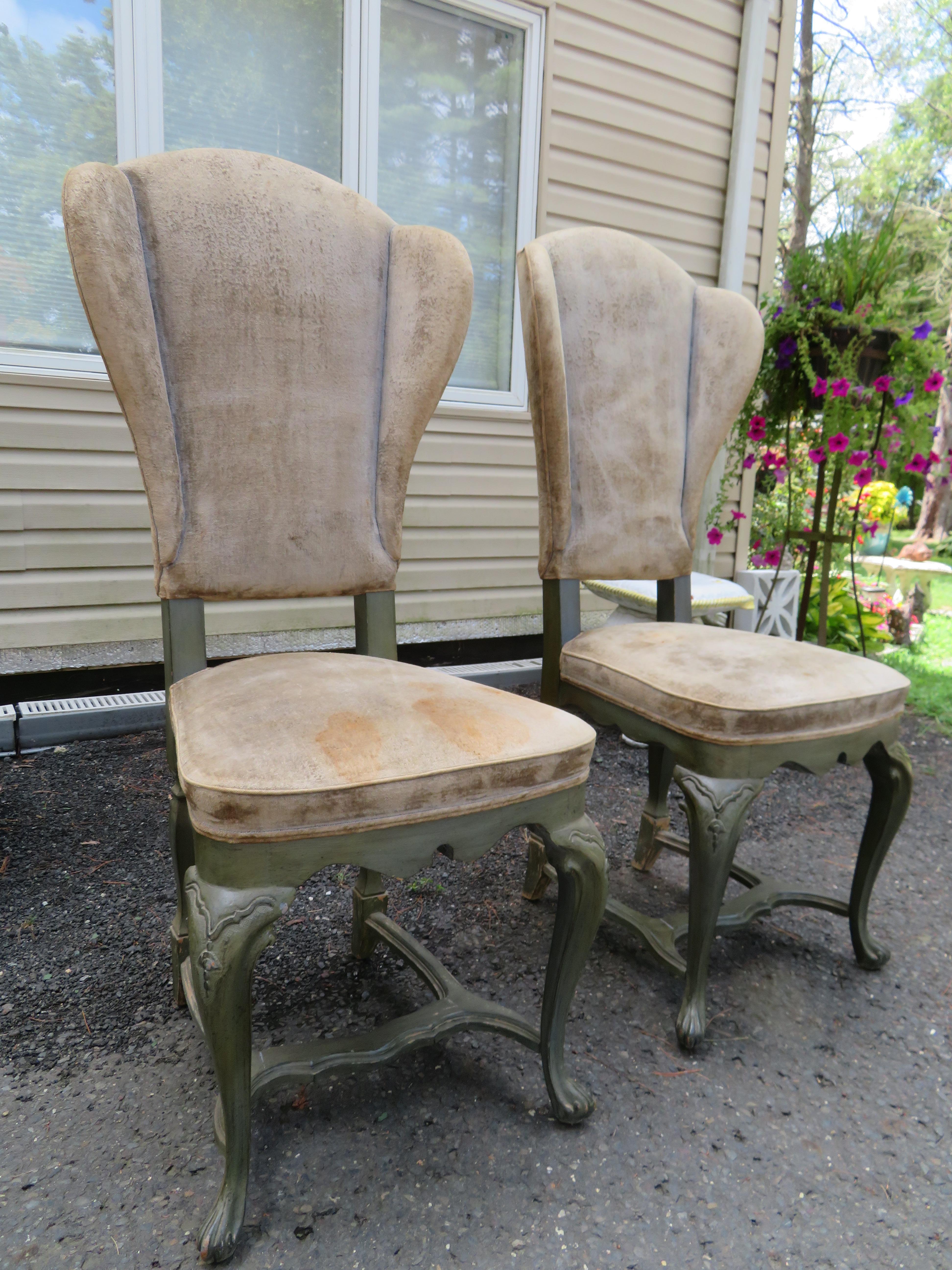 Stylish pair of Italian Regency Rococo tall slender dining chairs with wing-backs, cabriole legs, 
 and quality craftsmanship. Circa Mid-20th century. These chairs measure 46.5