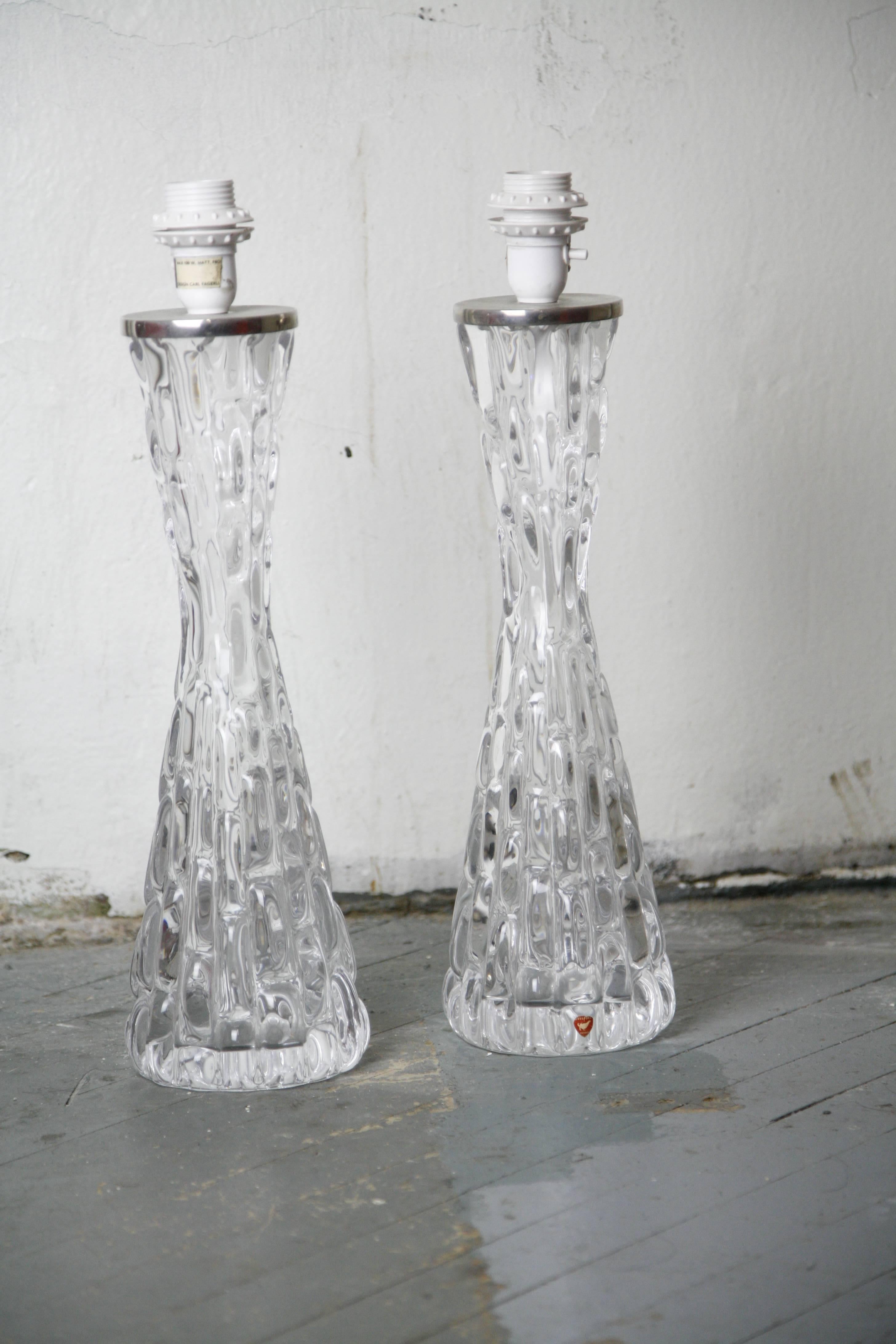 Tall pair of 1970s clear crystal Orrefors lamps, 1970
This is an exceptional large heavy signed pair of clear crystal lamps by Orrefors with chrome fittings, signed Carl Fagerlund Orrefors.

