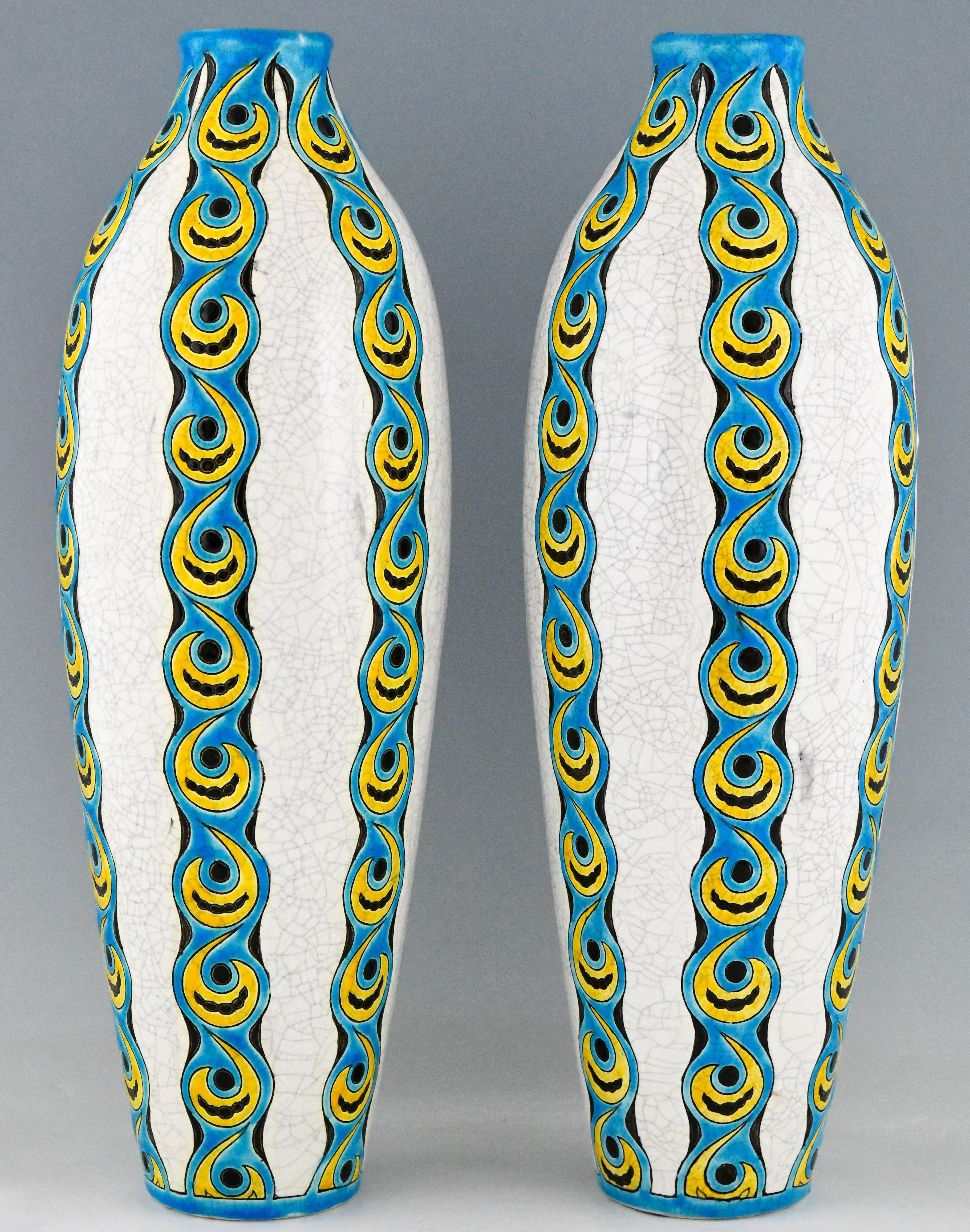 Impressive pair of Art Deco turquoise, yellow, black and white craquelé vases. Designed by Charles Catteau. Executed by Boch Frères La Louviere, Belgium. Marks: Boch La Louvriere stamp. Ct for Catteau. Numbered D738 for the decor. Dated: