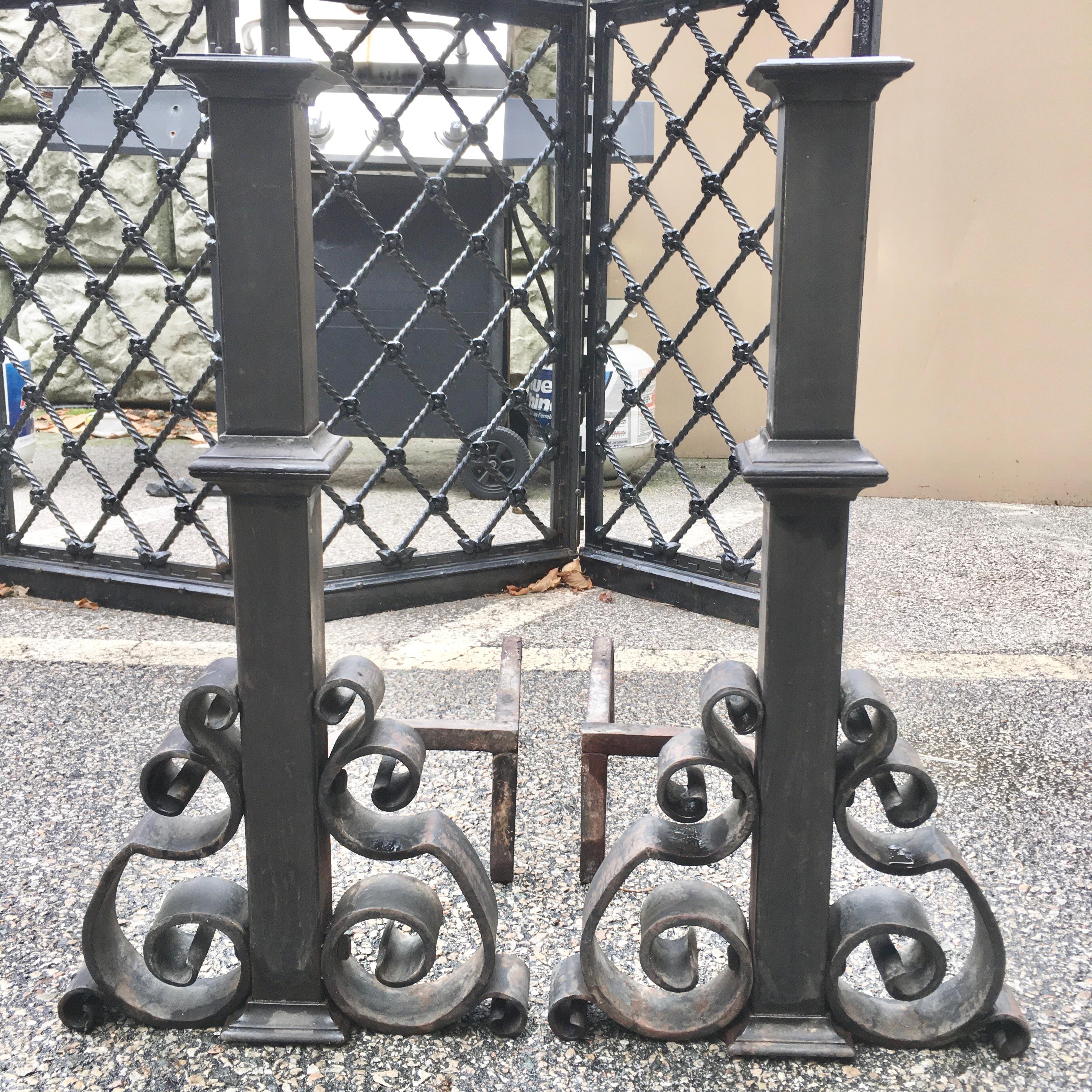 Antique pair of large-scale andirons forged with cast and wrought iron, attributed to E. F. Caldwell.
26 inches high. 25 inches deep including firedogs. 14 inches wide.
