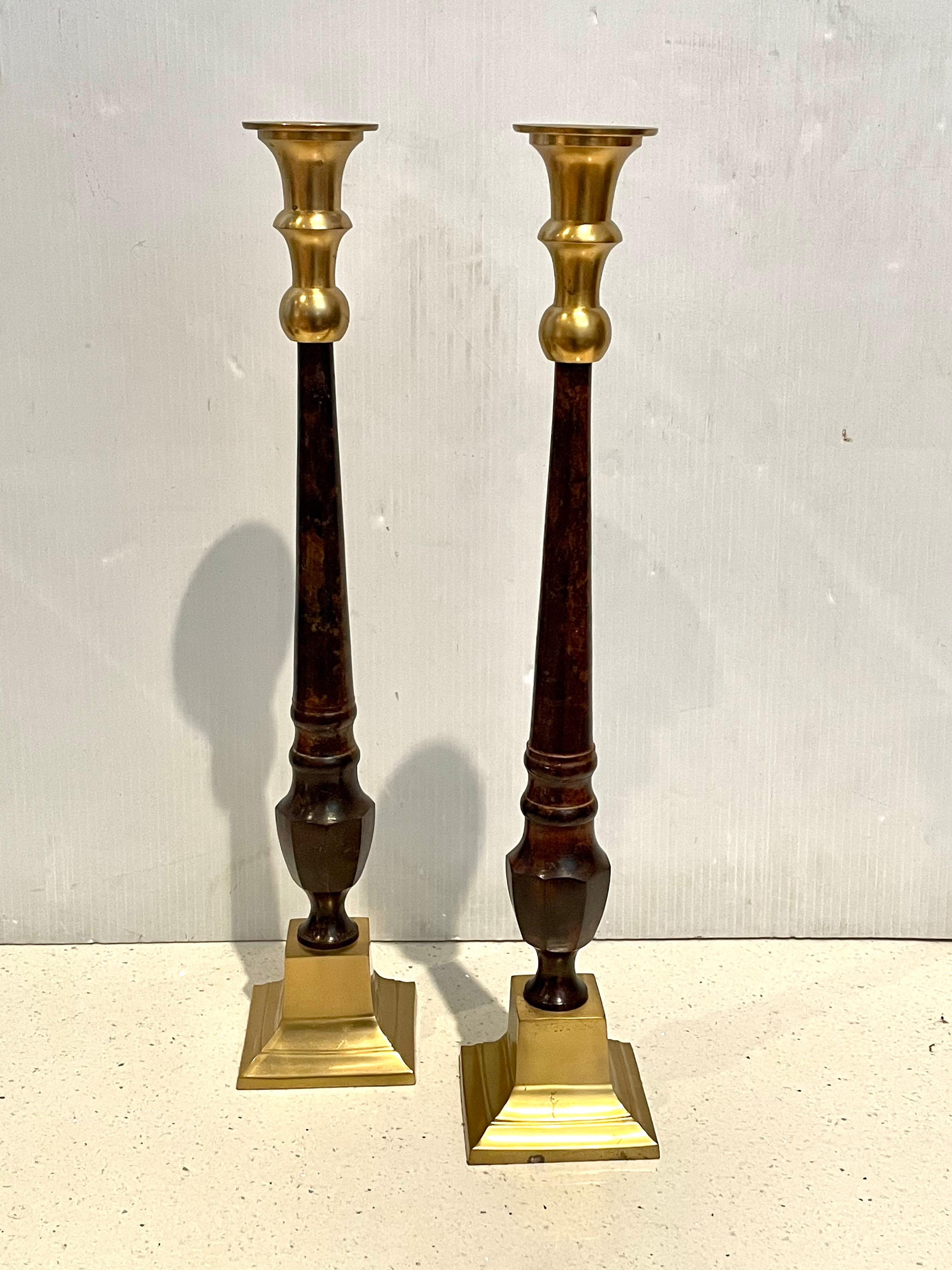 Beautiful majestic pair of tall solid brass candle holders, all in brass and faux marble painted centers, great quality.