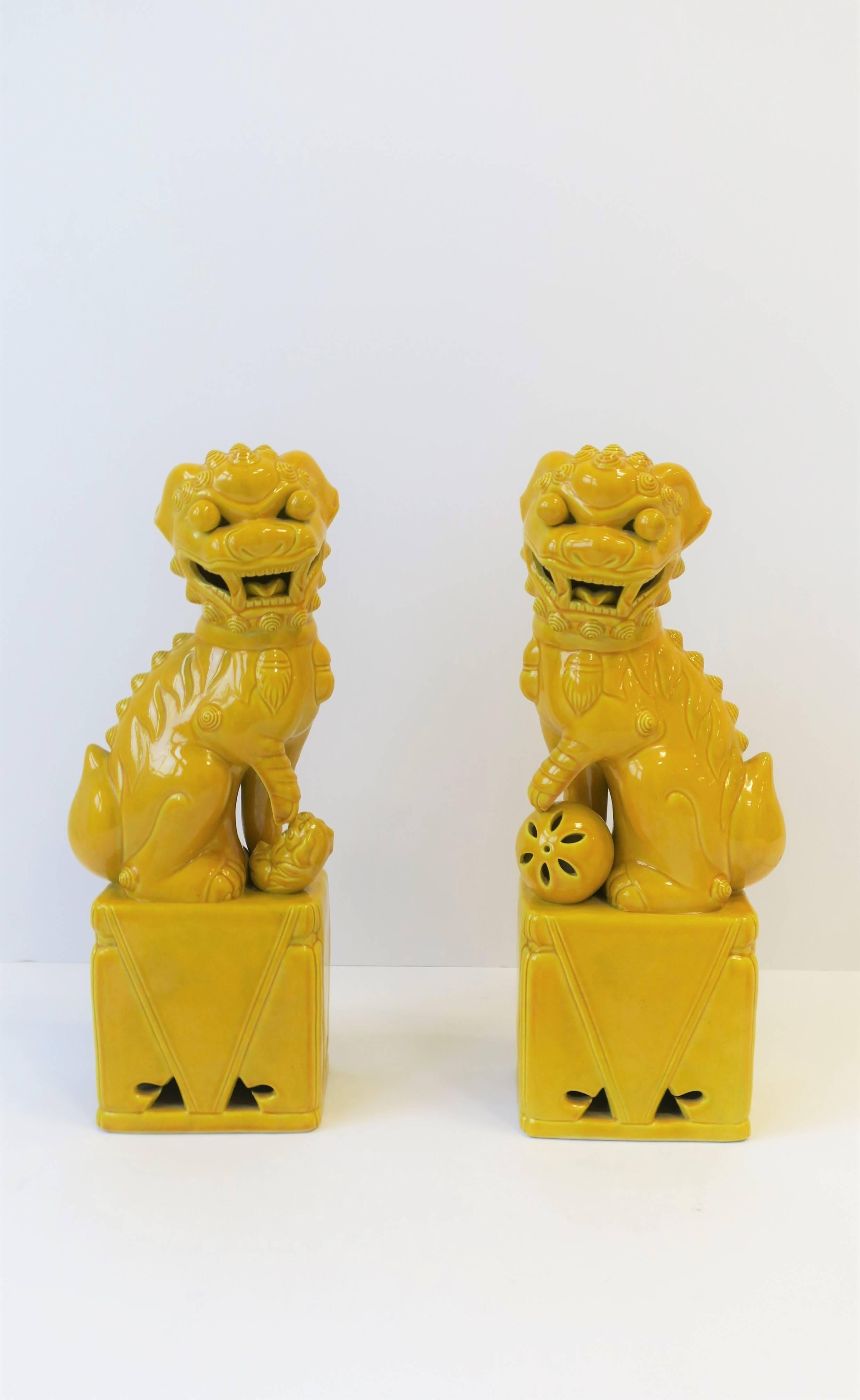 Chinoiserie Pair of Tall Midcentury Yellow Foo Dogs or Lion Sculptures 