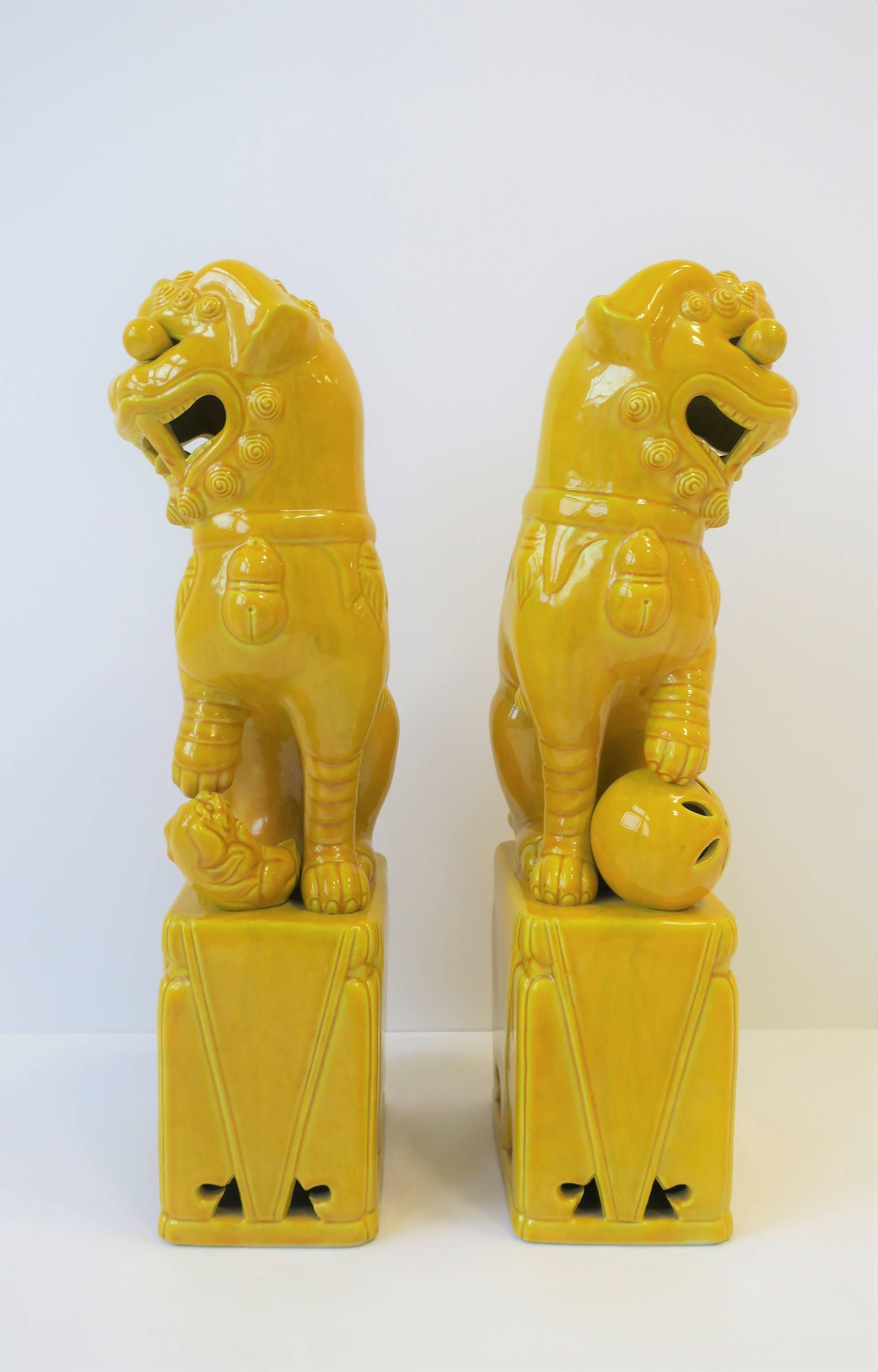 Ceramic Pair of Tall Midcentury Yellow Foo Dogs or Lion Sculptures 