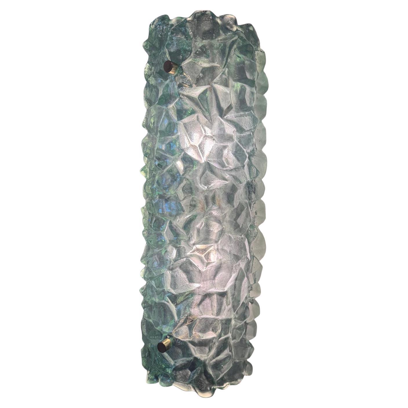 These sconces are made with a Murano glass which has been molded by hand by an Italian artisan who designed this glass texture. Each sconce has 2 Lights. American wired. 