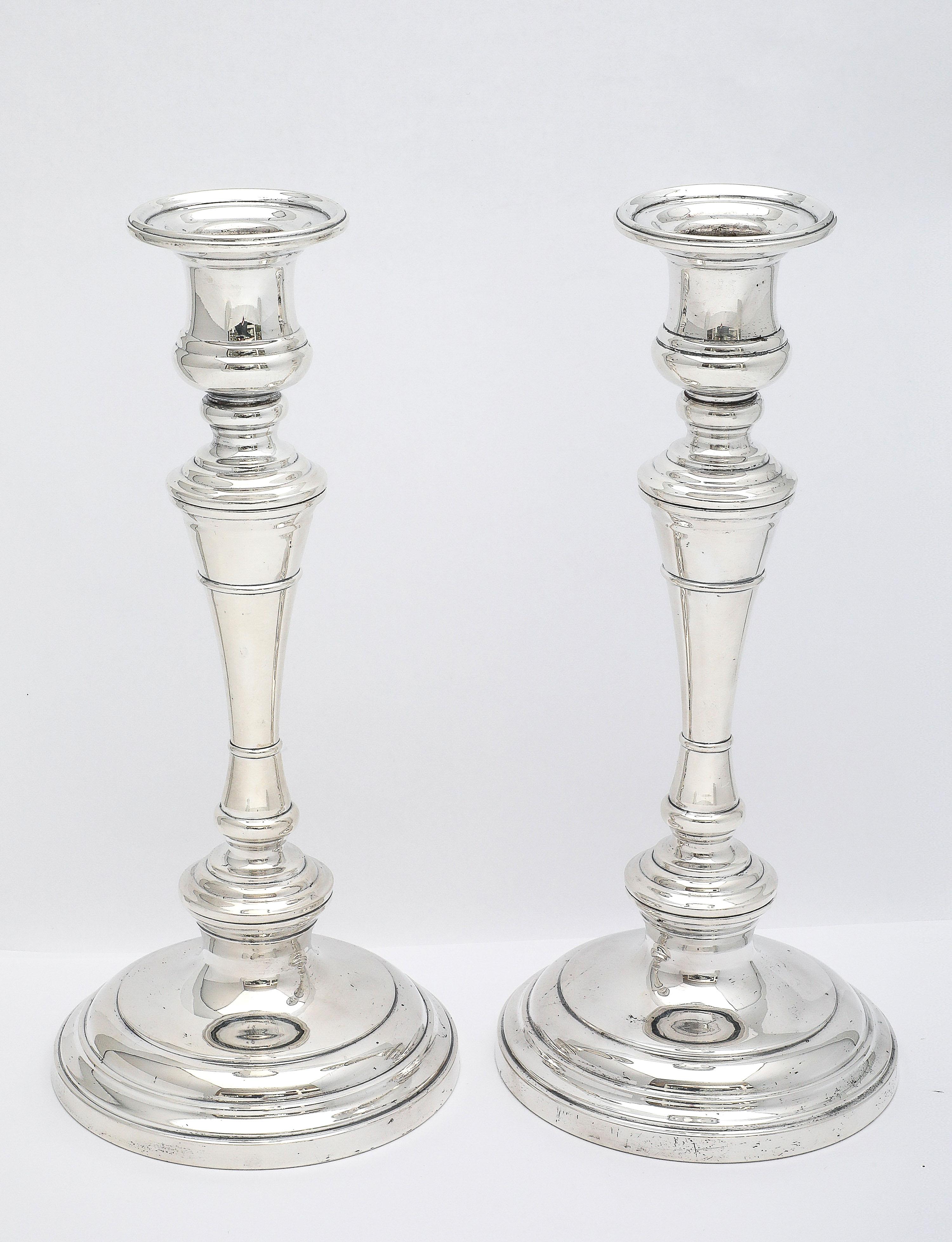 Pair of tall, sterling silver, George III-Style candlesticks, S. Kirk and Son, Baltimore, Maryland, Ca. 1930's. Beautifully designed, having classic lines. Each candlestick comes apart into three sections. These sections can then be screwed together