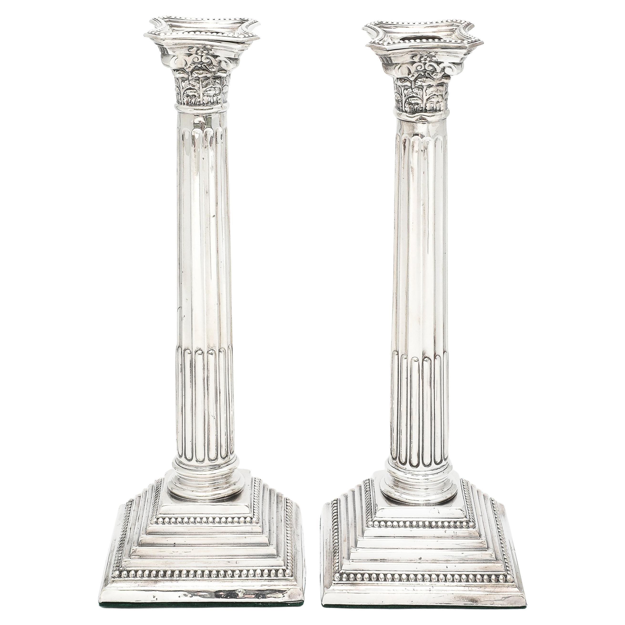 Very tall pair of Neoclassical-style, sterling silver, Corinthian Column-form candlesticks, Birmingham, England, year-hallmarked for 1967, William A. Humphries, Ltd. - maker. Each candlestick measures approximately 11 1/4 inches high x 4 inches wide