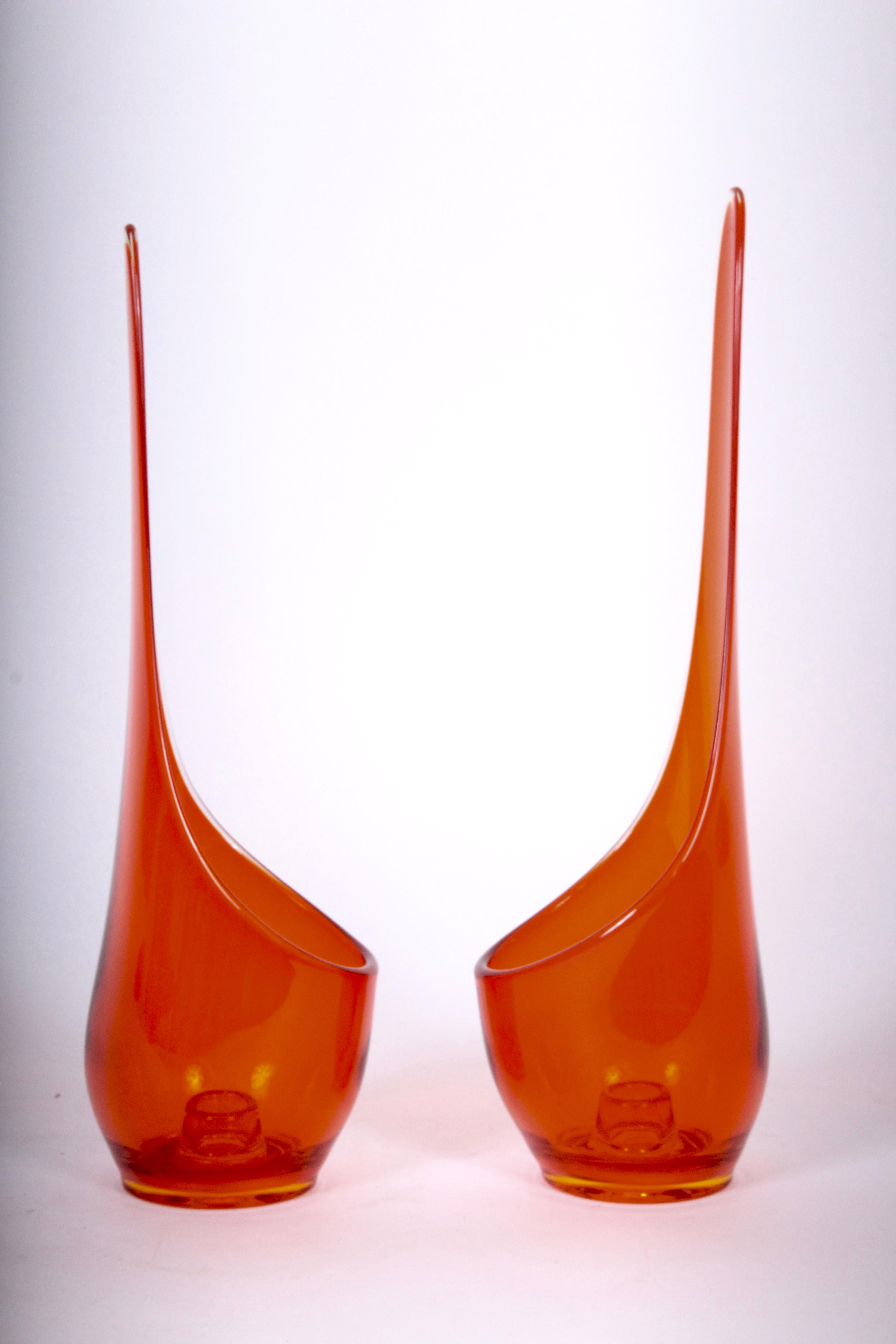 Large American Mid-Century Modern pair of Viking glass company translucent taperglow art glass candlesticks in deep orange. Sculptural. Statuesque. Glass unmarked. Label no longer evident. Without scratches, 1960s. Made in West Virginia.

 