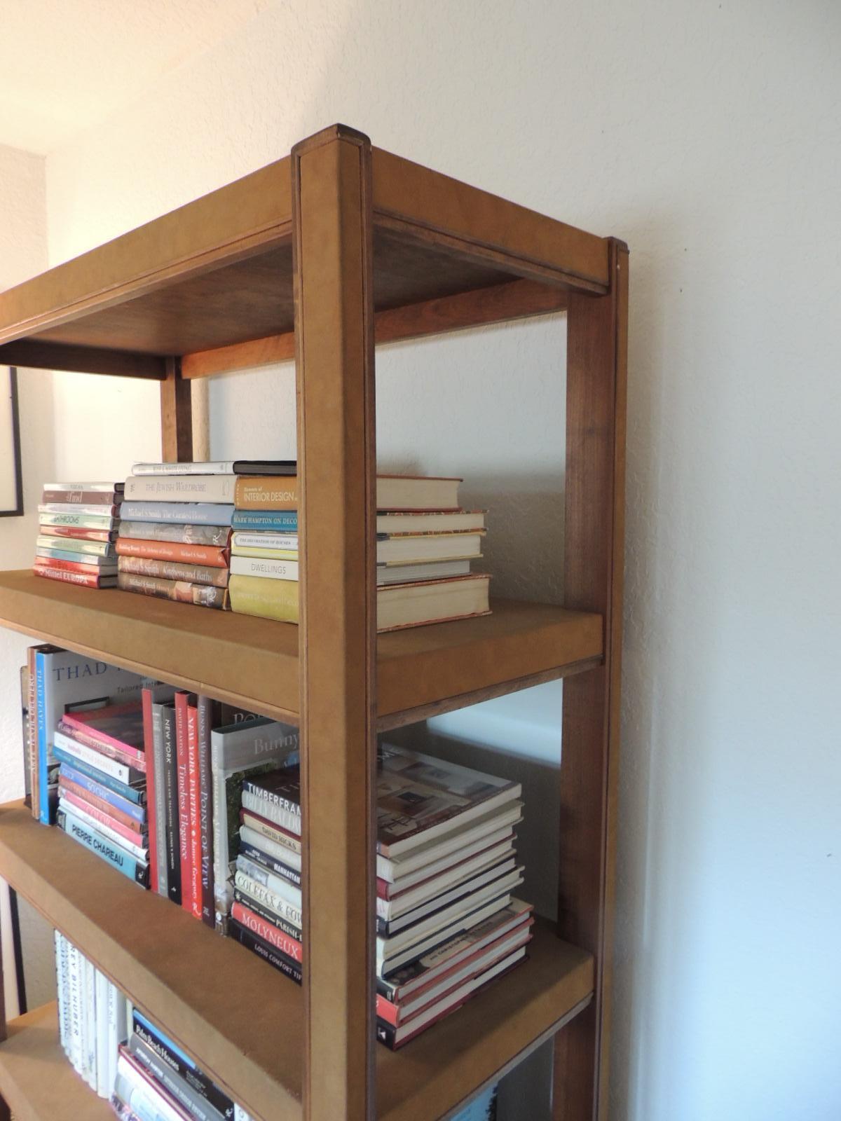 Tall Parson style custom designed tobacco suede color bookcase
custom-made tall Parsons Style rectangular bookcase. Covered in suede texture paper and wood veneer details. Finished on all sides can be used freestanding in any room. The under- side