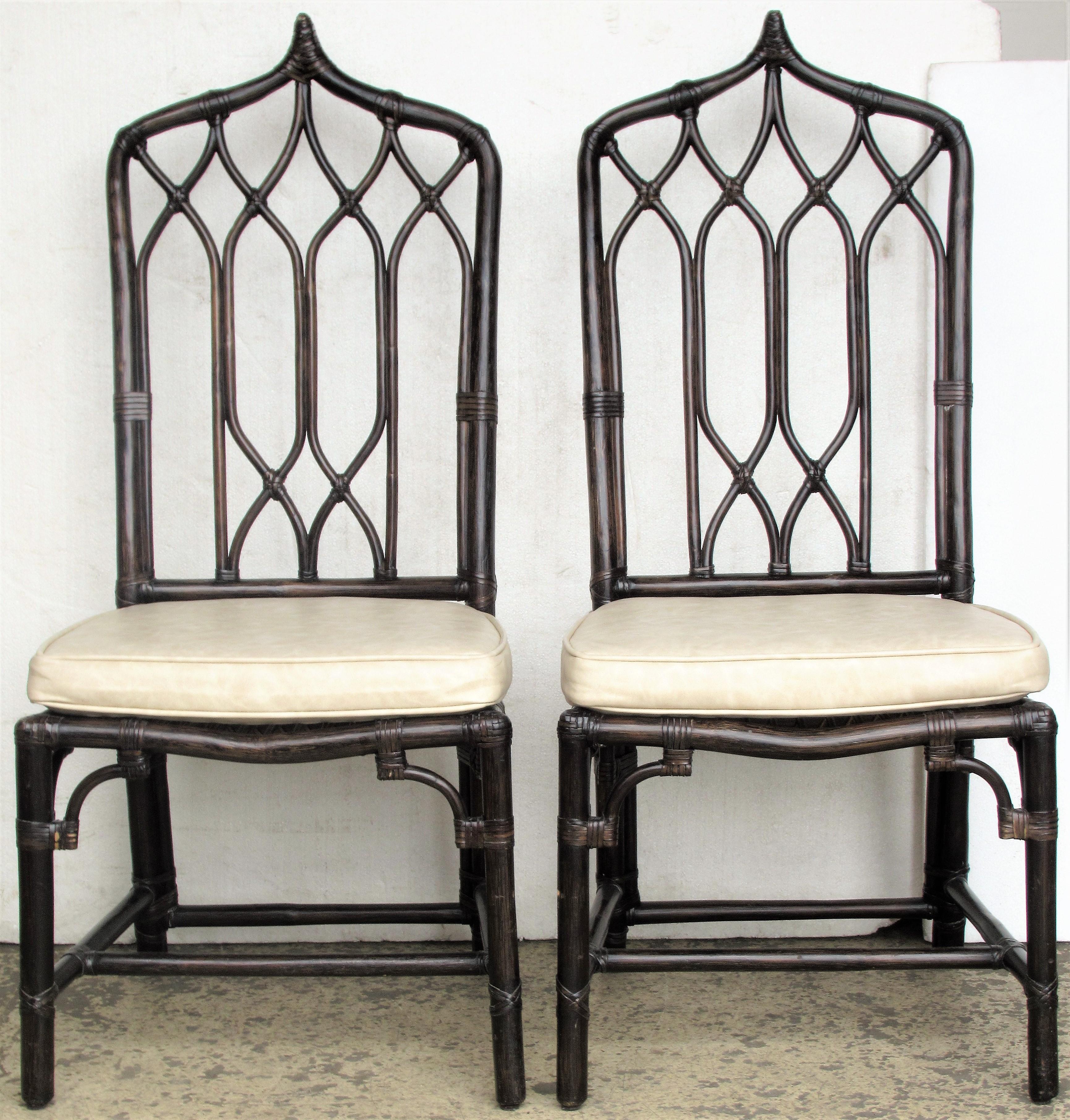 Matching set of four Chinese Chippendale / cathedral style tall peaked top chairs by McGuire in great all original condition. McGuire of San Francisco brass tags present on underside, circa 1970s. Look at all pictures and read condition report in