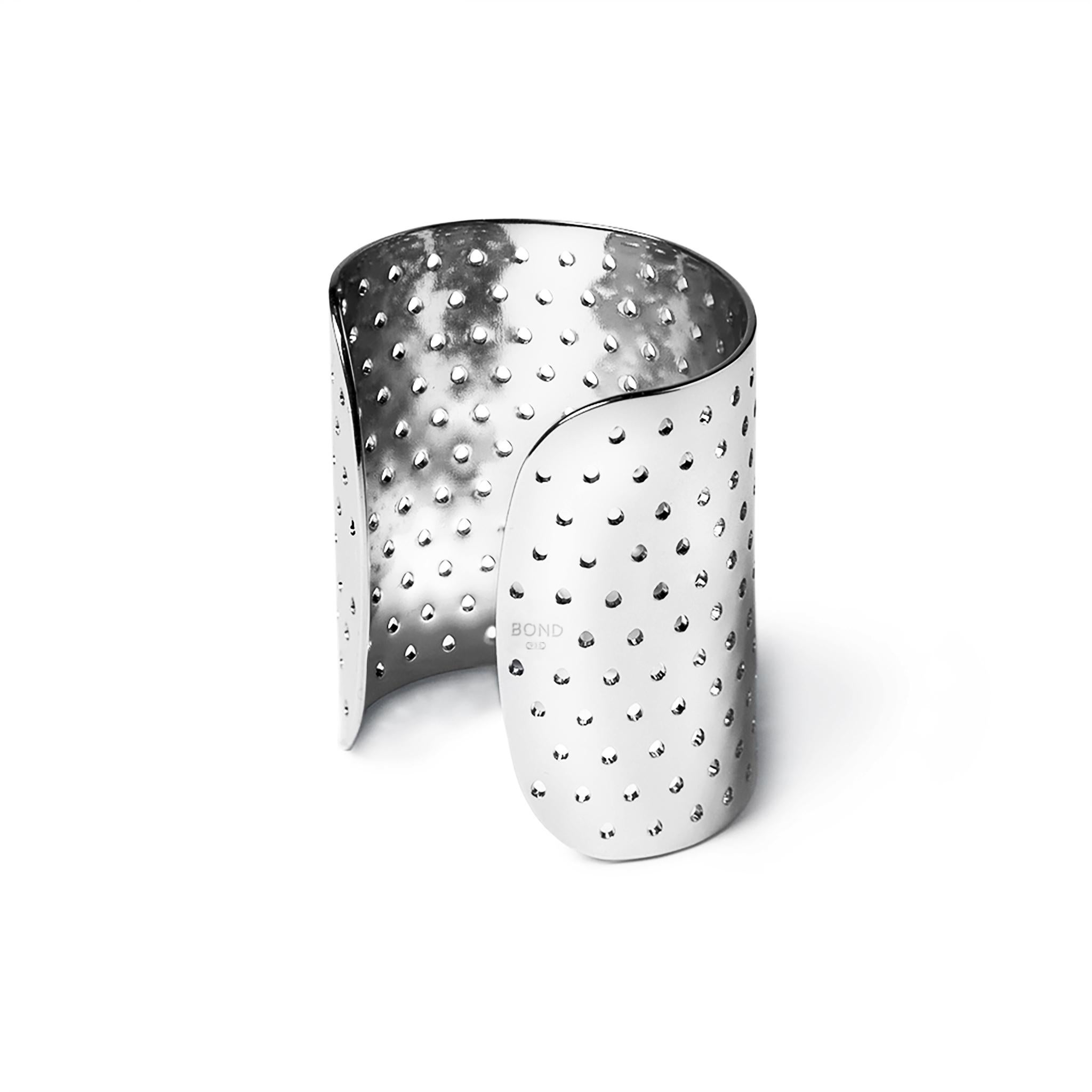 Breathable, perforated metal cuff bracelet in solid, hypoallergenic 935 Silver. Wear alone, as a set, or as part of a stack. 

FEATURES
- Available in a selection of sustainable, recycled metals: 935 Silver or 18K Gold.
- Hypoallergenic,