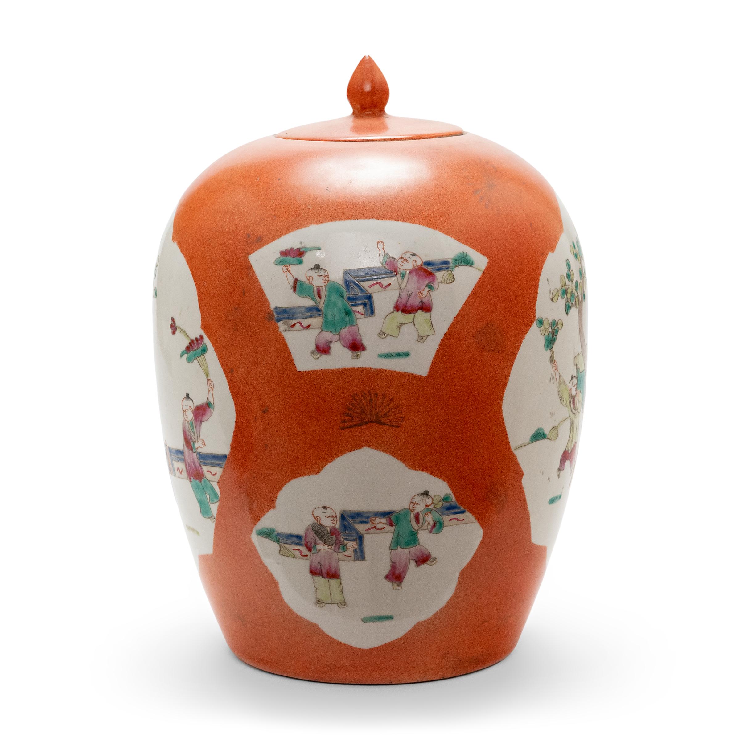 This vase is the perfect example of enduring Chinese symbolism and design. Each side of the ginger jar bears a cartouche painting containing a picturesque scene. Attendants watch over young boys in a traditional garden, while some practice martial