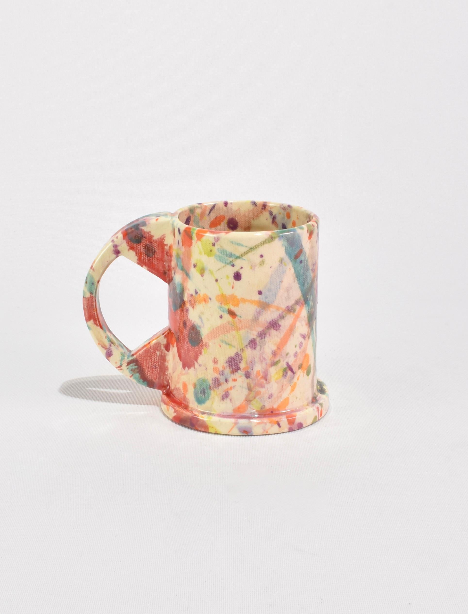 One-of-a-kind Tall Splatter Mugs designed by Peter Shire. These functional and sculptural mugs are crafted by Echo Park Pottery in Los Angeles using slab construction and individually hand-painted. Stamped on base: EXP 2023. Sold