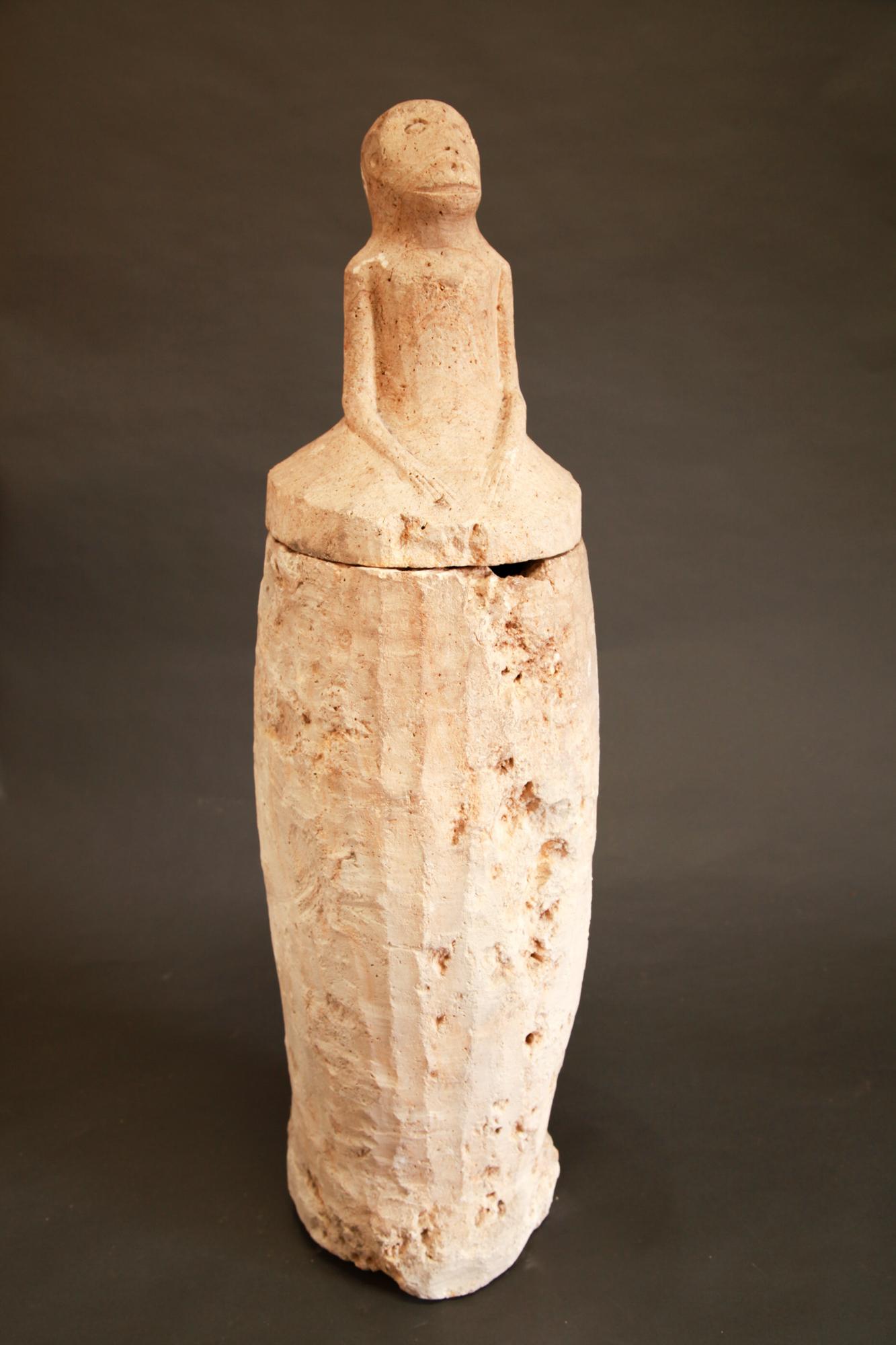 Tall Philippine lidded limestone secondary burial jar, 11th-15th century.

This tall limestone jar was used for secondary burial purposes by the Manobo people of Cotobato, Mindanao. The skull and selected long bones of the deceased were exhumed,