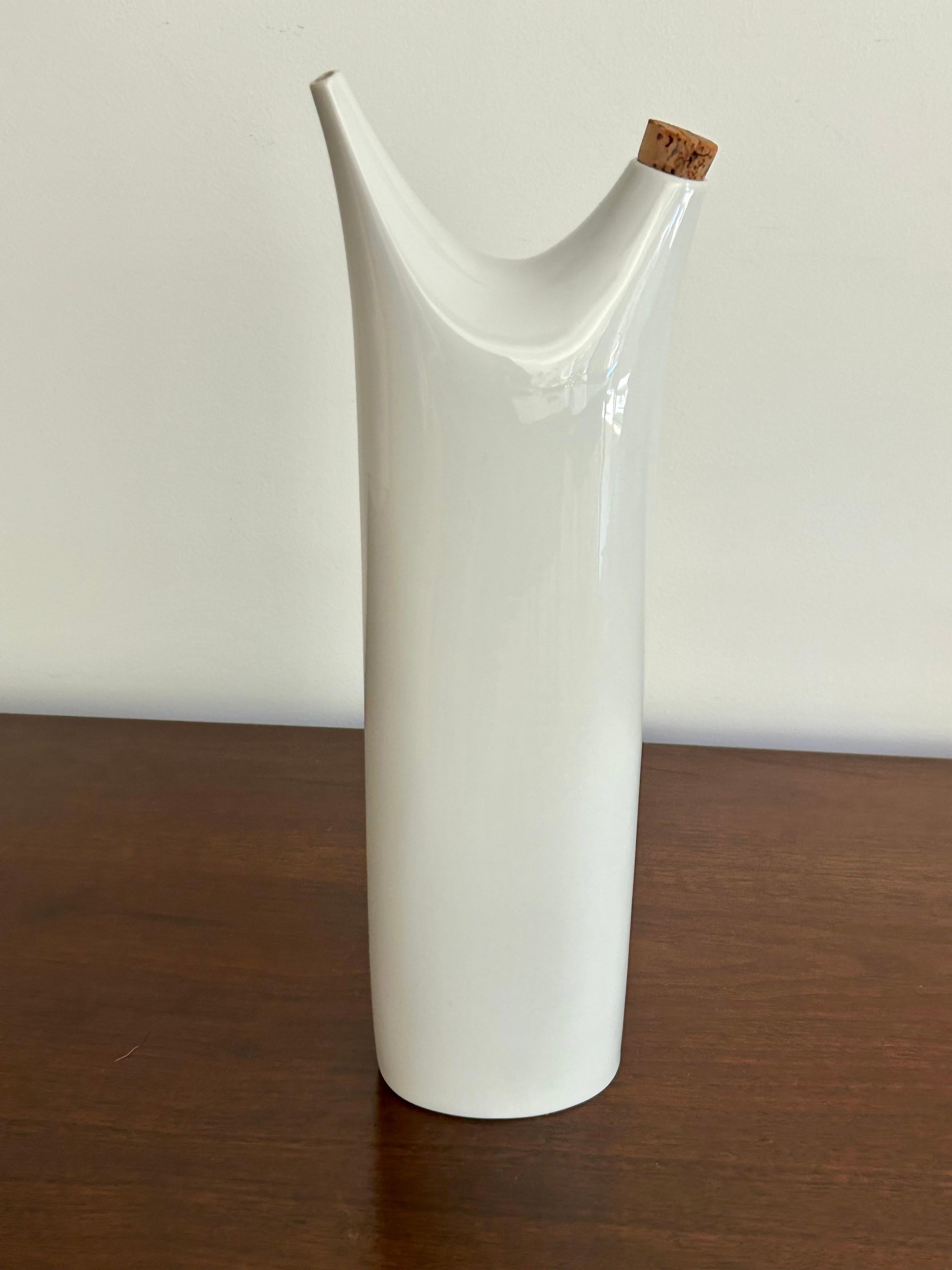 Rare form + function.
Made of porcelain with original cork top.
Great for any occasion; cruet, weed vase and collections.
