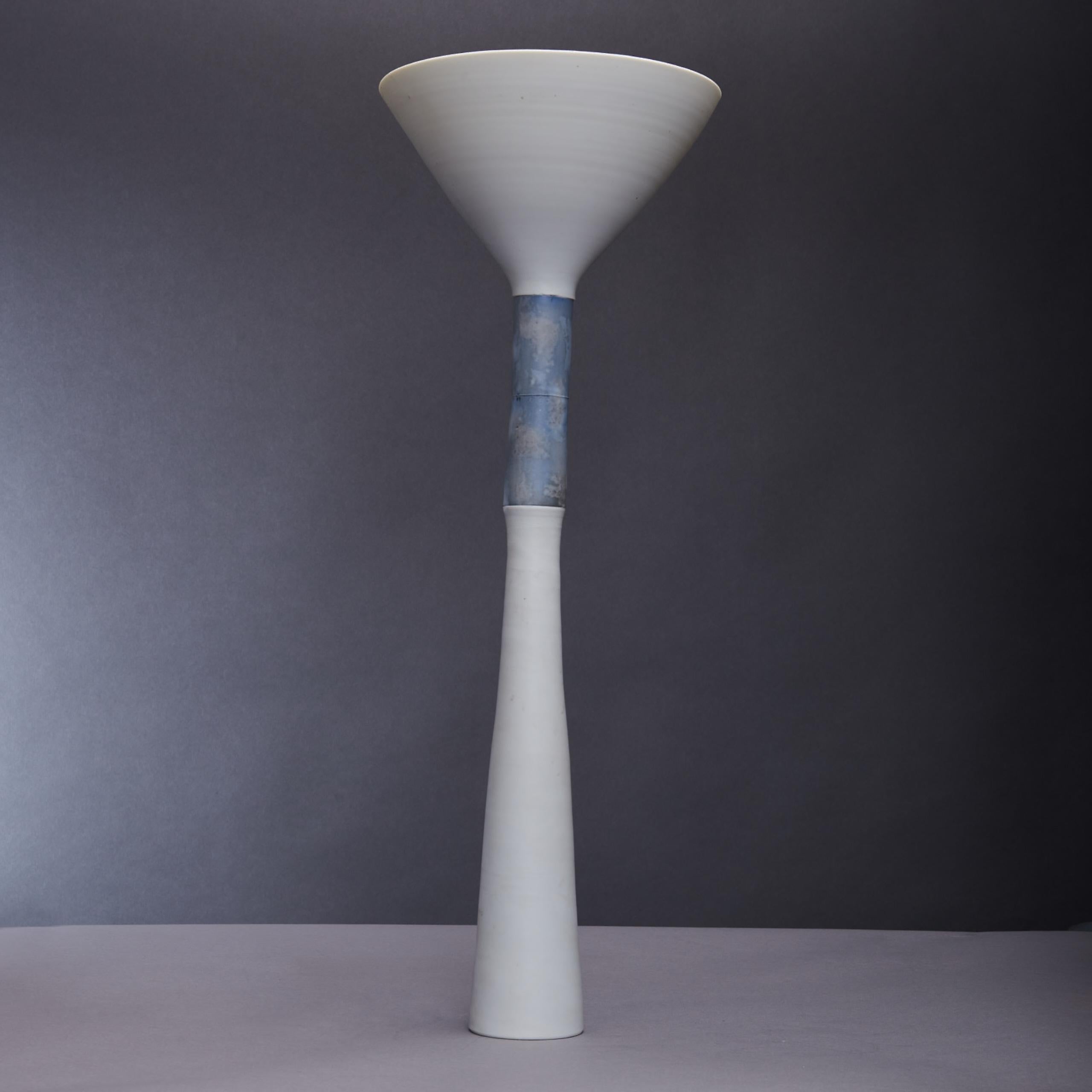 Tall elegant ornamental art vase or vessel by Thomas Naethe is turned on the wheel and assembled in porcelain. Although the work refers to vessel forms it is essentially sculptural in nature. Formal precision, harmony and clarity are words that are