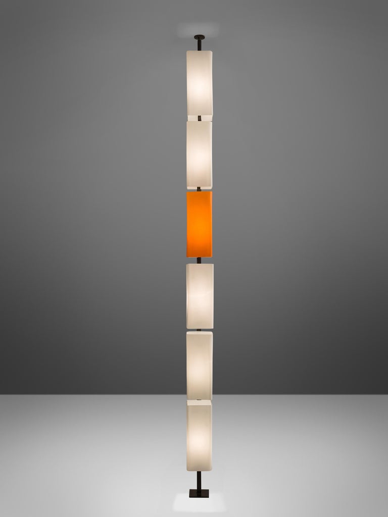 Floor lamp, orange and white glass, Italy, 1960s. 

This rare and unique floor lamp is typical for the Postmodern design of the 1970s in Italy. The different glass lamp shades are placed above one another and form a simplistic yet playful whole