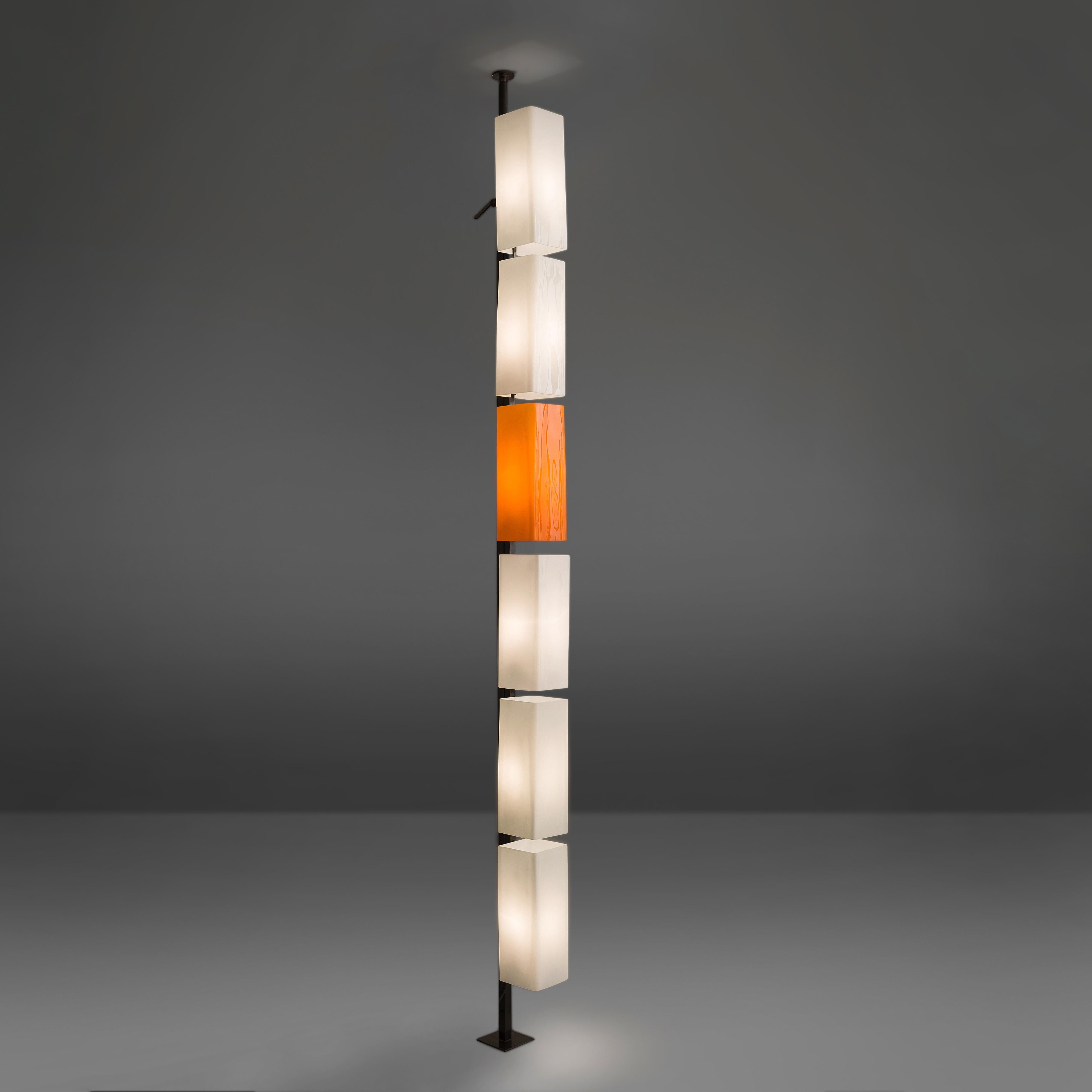 Floor lamp, orange and white glass, Italy, 1960s. 

This rare and unique floor lamp is typical for the Postmodern design of the 1970s in Italy. The different glass lamp shades are placed above one another and form a simplistic yet playful whole