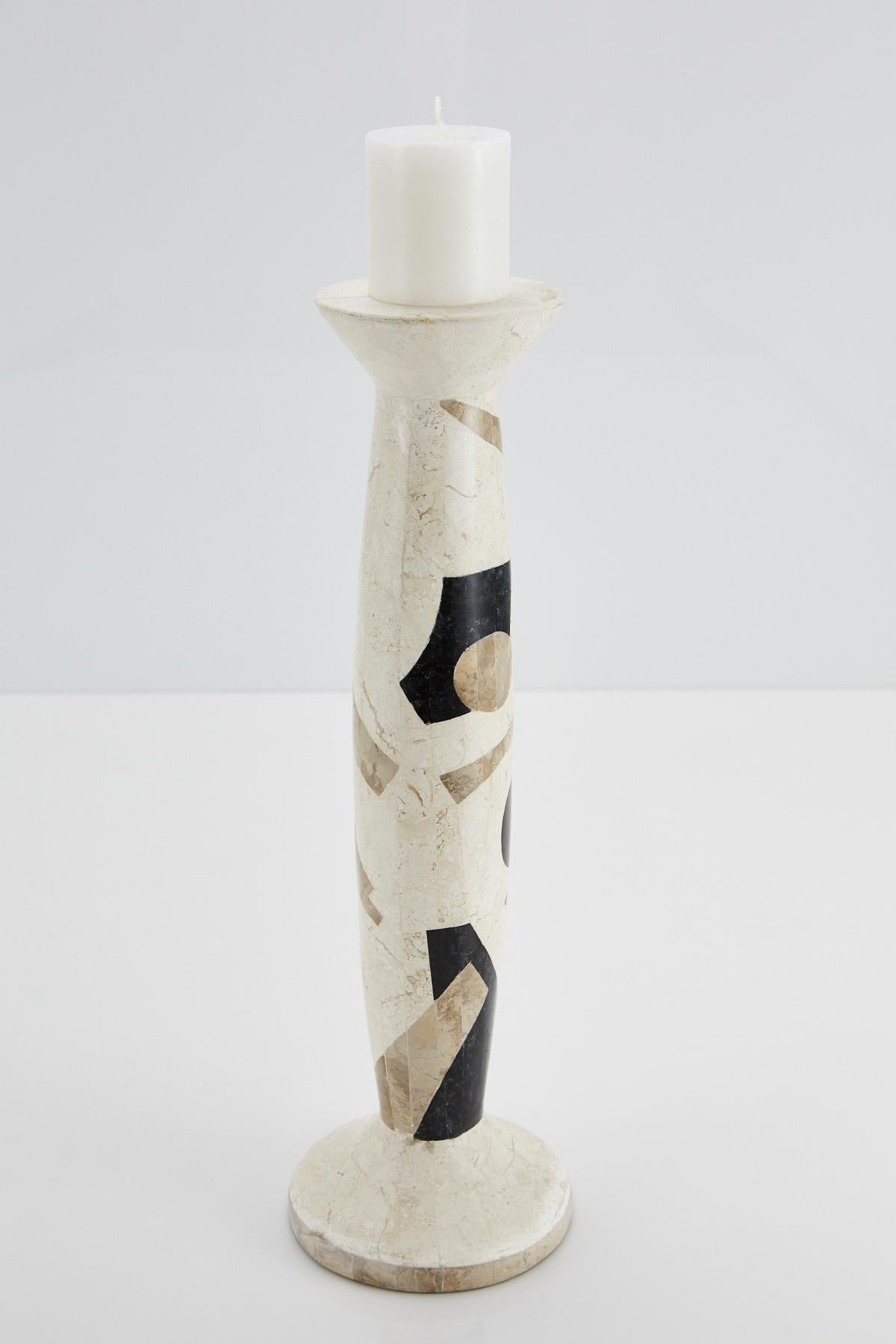 Tall pillar candleholder. Body is comprised of fiberglass with exterior completely covered in black, white and beige tessellated stone in a fun Postmodern pattern. 

All furnishings are made from 100% natural Fossil Stone or Seashell inlay,