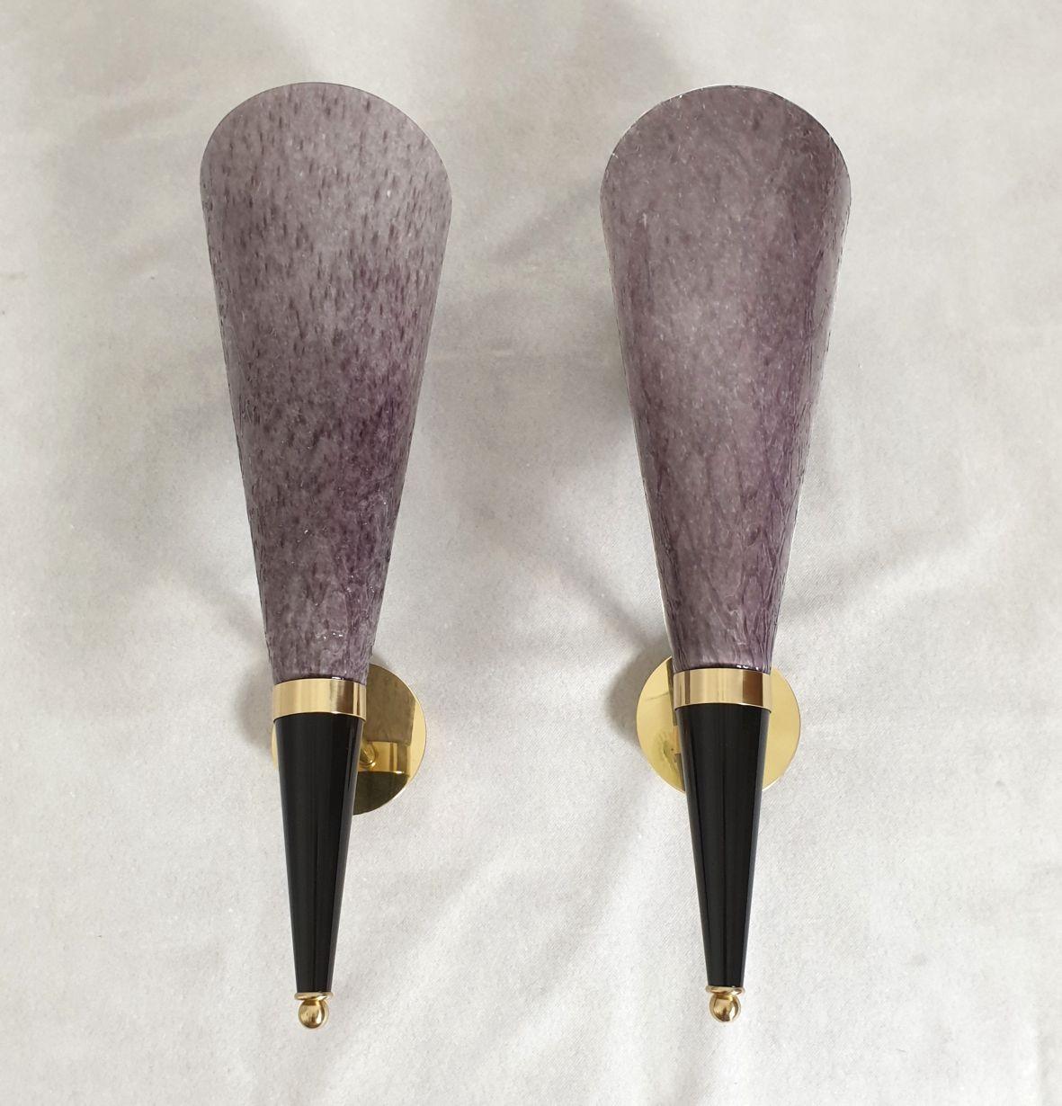 Pair of tall purple Murano glass and brass sconces by Mila Schon, Italy Mid Century Modern. Circa 1970.
The sconces are stamped: Mila Schon, Arte Vetro di Murano, on the glasses.
The sconces are tall, made of a purple textured Murano glass cone,