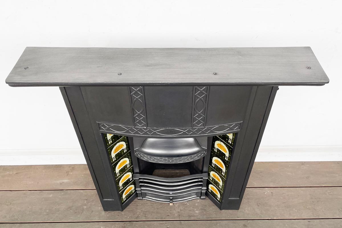 20th Century Tall reclaimed early 20th century cast iron combination fireplace For Sale