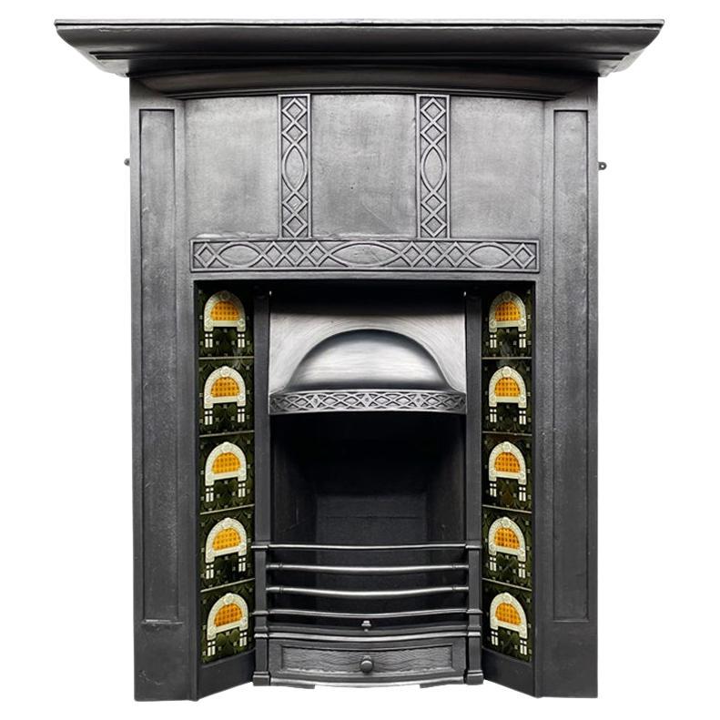 Tall reclaimed early 20th century cast iron combination fireplace