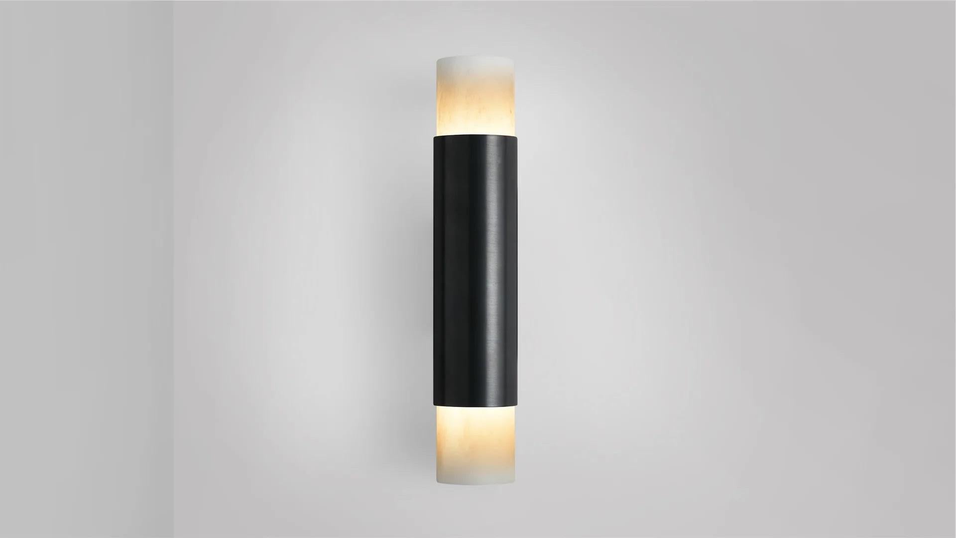 Tall Roma wall lamp by CTO Lighting
Materials: bronze, alabaster.
Dimensions: D 8.5 x W 5.5 x H 28 cm
Available in satin brass and bronze.

Celebrating the simplicity of line and form, The Roma collection is designed to highlight the noble quality
