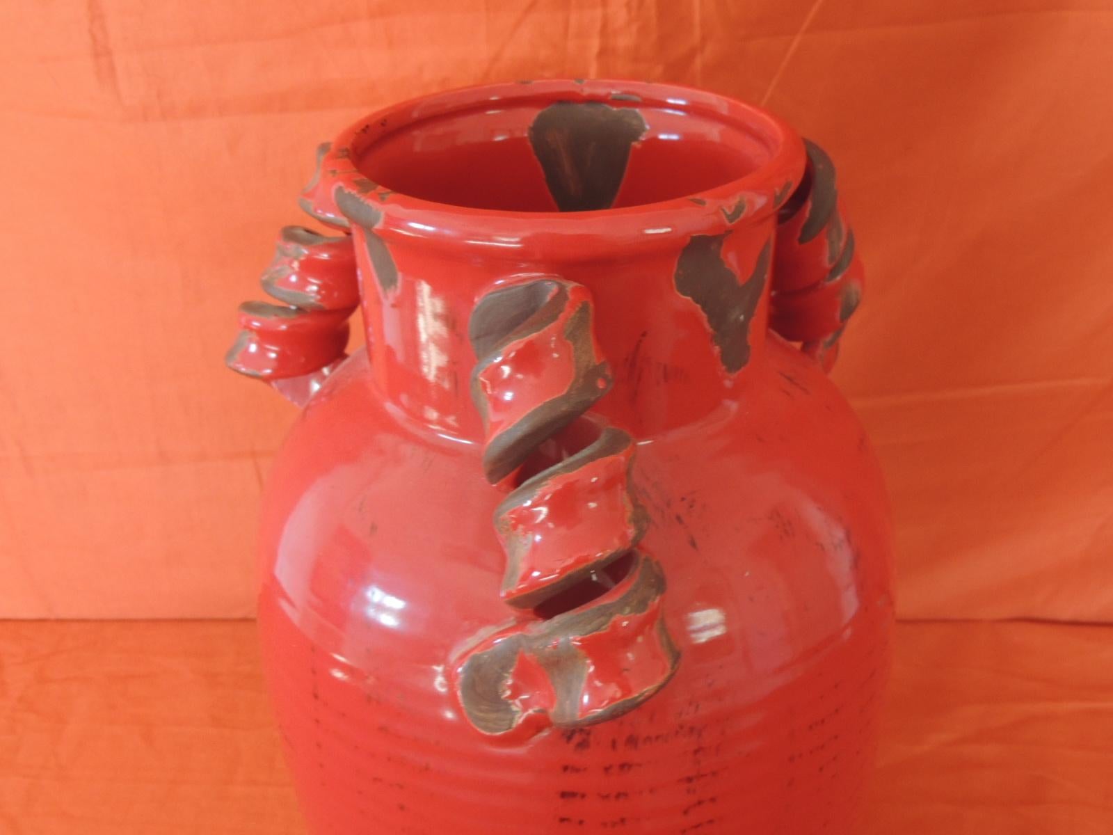 red ceramic vases and urns