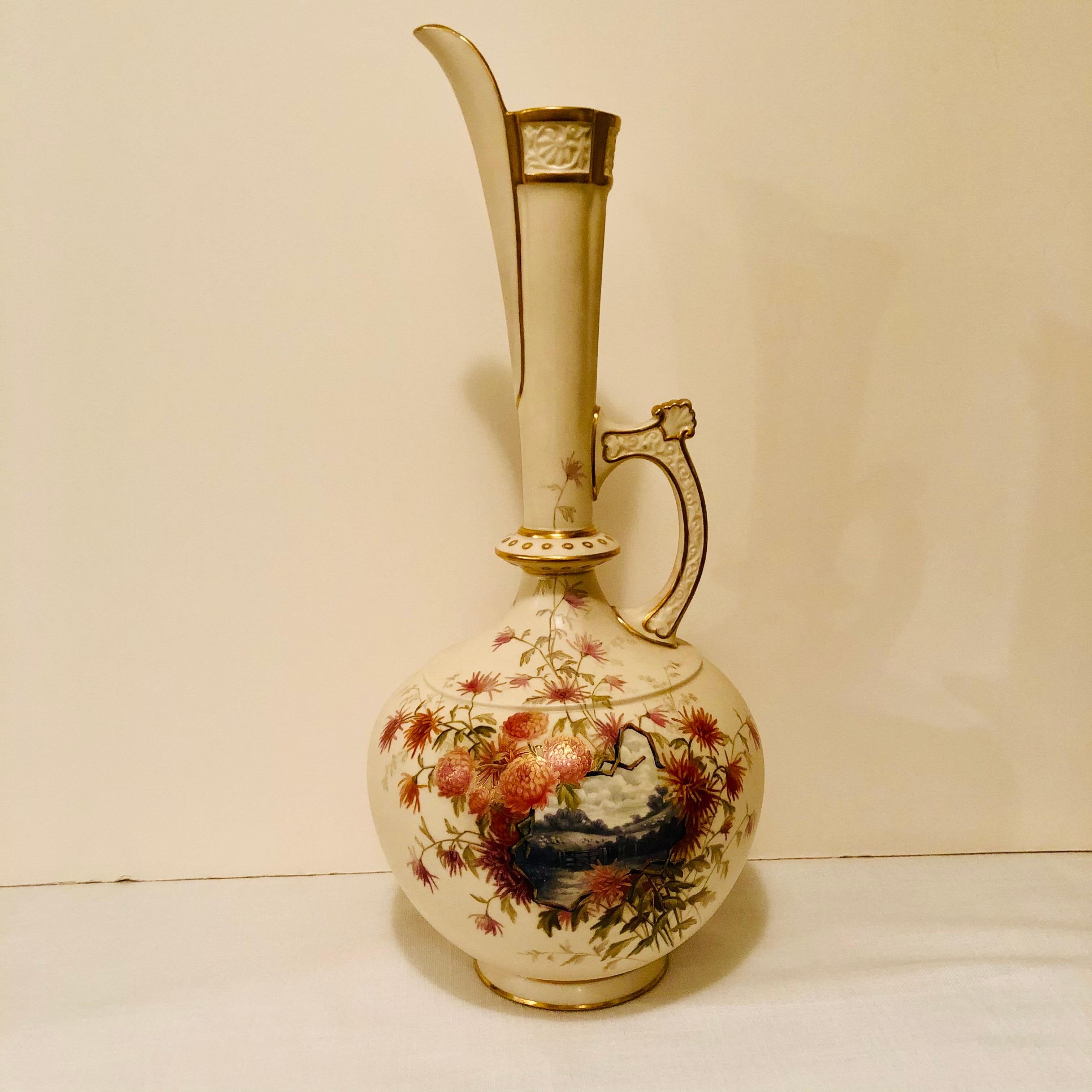 I would like to offer you this tall Royal Worcester vase or ewer, which is hand painted with a beautiful pastoral scene surrounded by gorgeous flower paintings. If you look at the scene closely, you can see the sheep in the background. The handle