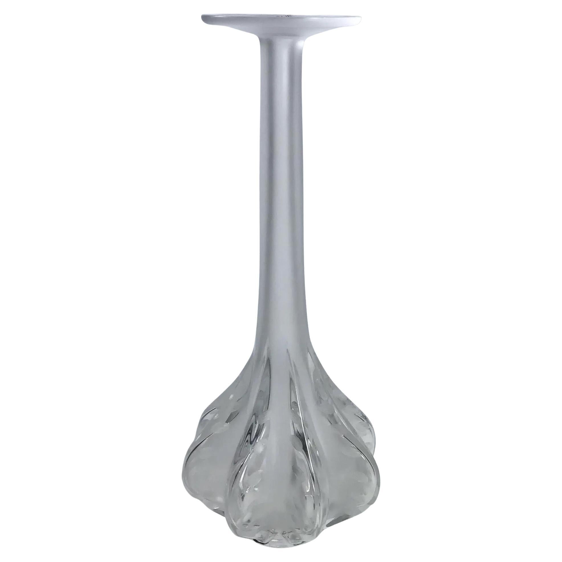 Tall satin crystal stick neck vase by Marie-Claude Lalique for Lalique of France, circa 1990s. Sleek and sculptural, this elegant vase features a fluted neck with a flared rim and oval cut detailing. Designed by Marie Claude Lalique, a ribbed body