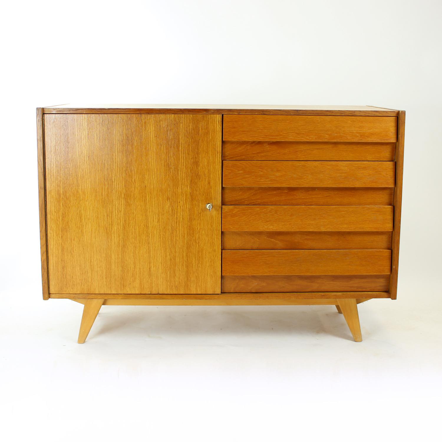 Beautiful tall sideboard designed by Jiri Jiroutek for Interier Praha in Czechoslovakia in 1960s, original labels still attached. The sideboard consists of three parts. The bottom part is the U 459 sideboard with oak wood veneered finish. The left