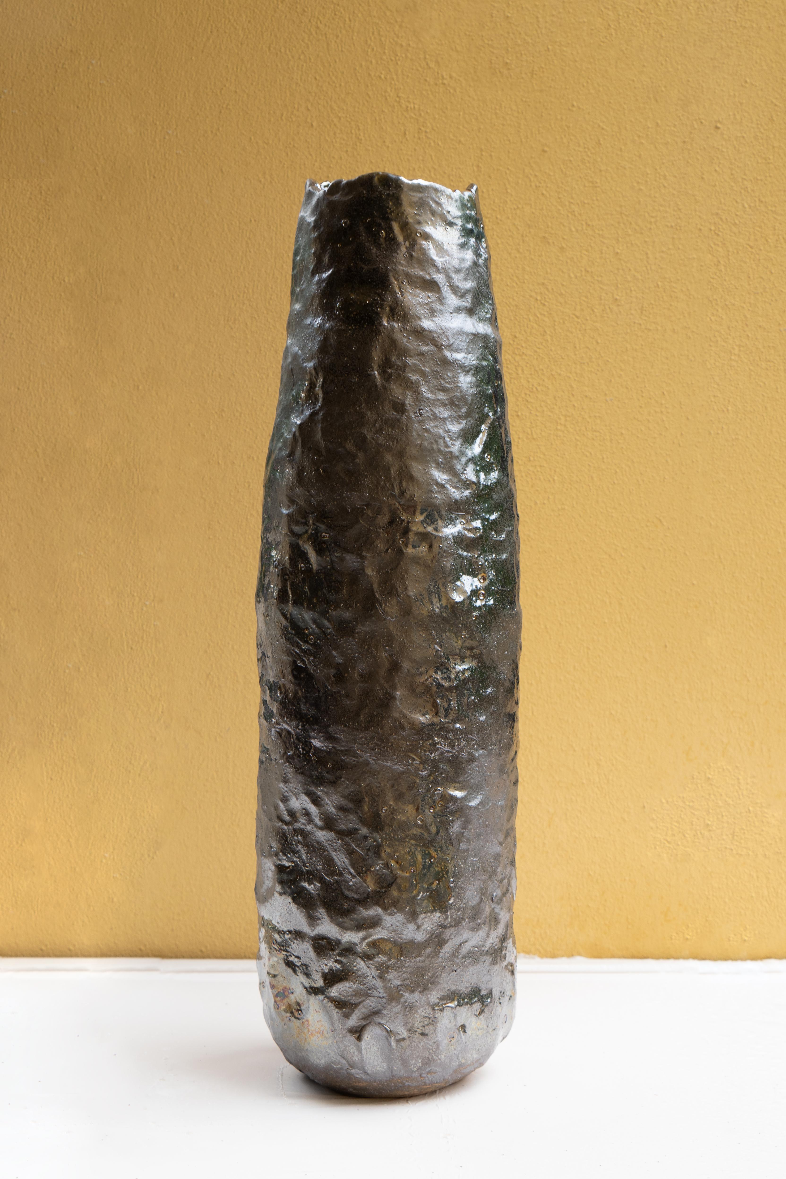 Tall silver bronze vase by Daniele Giannetti
Dimensions: Ø 63 x H 20 cm.
Materials: Glazed terracotta. 

All pieces are made in terracotta from Montelupo, only fired once, then colored by Daniele Giannetti with a white acrylic base, and then a