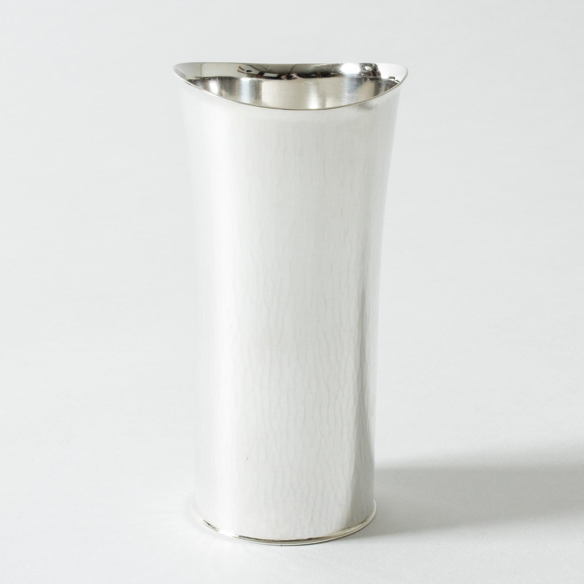 Elegant silver vase by Sigurd Persson, in a simplistic design that enhances the delicately hammered surface.