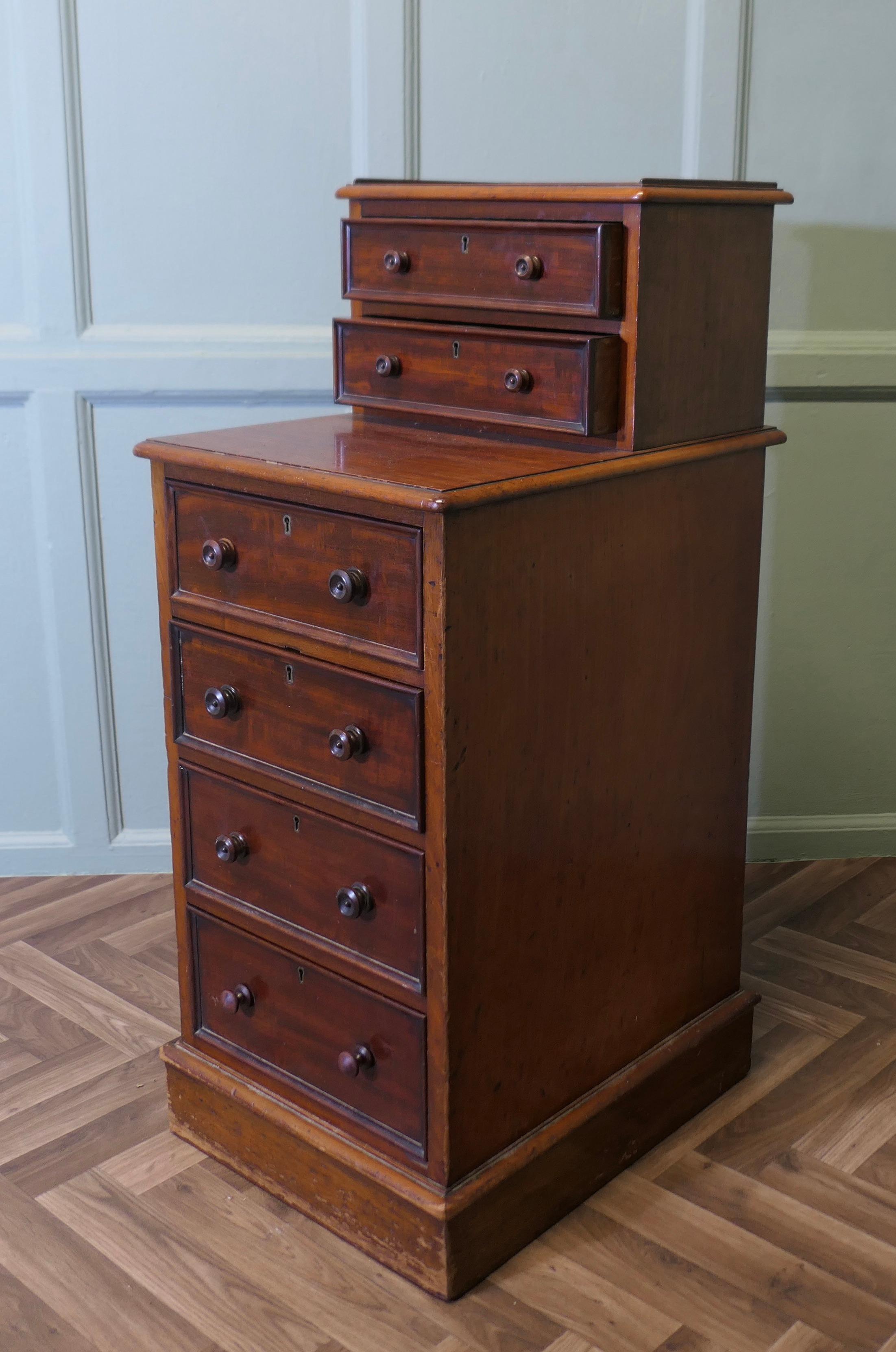 Tall Six Drawer Side Cabinet or Lamp Table

This is a fine quality piece, the cabinet has 4 drawers in the lower section under a small counter and has another 2 drawers above with a galleried top
The drawers all run very smoothly 
The chest is of