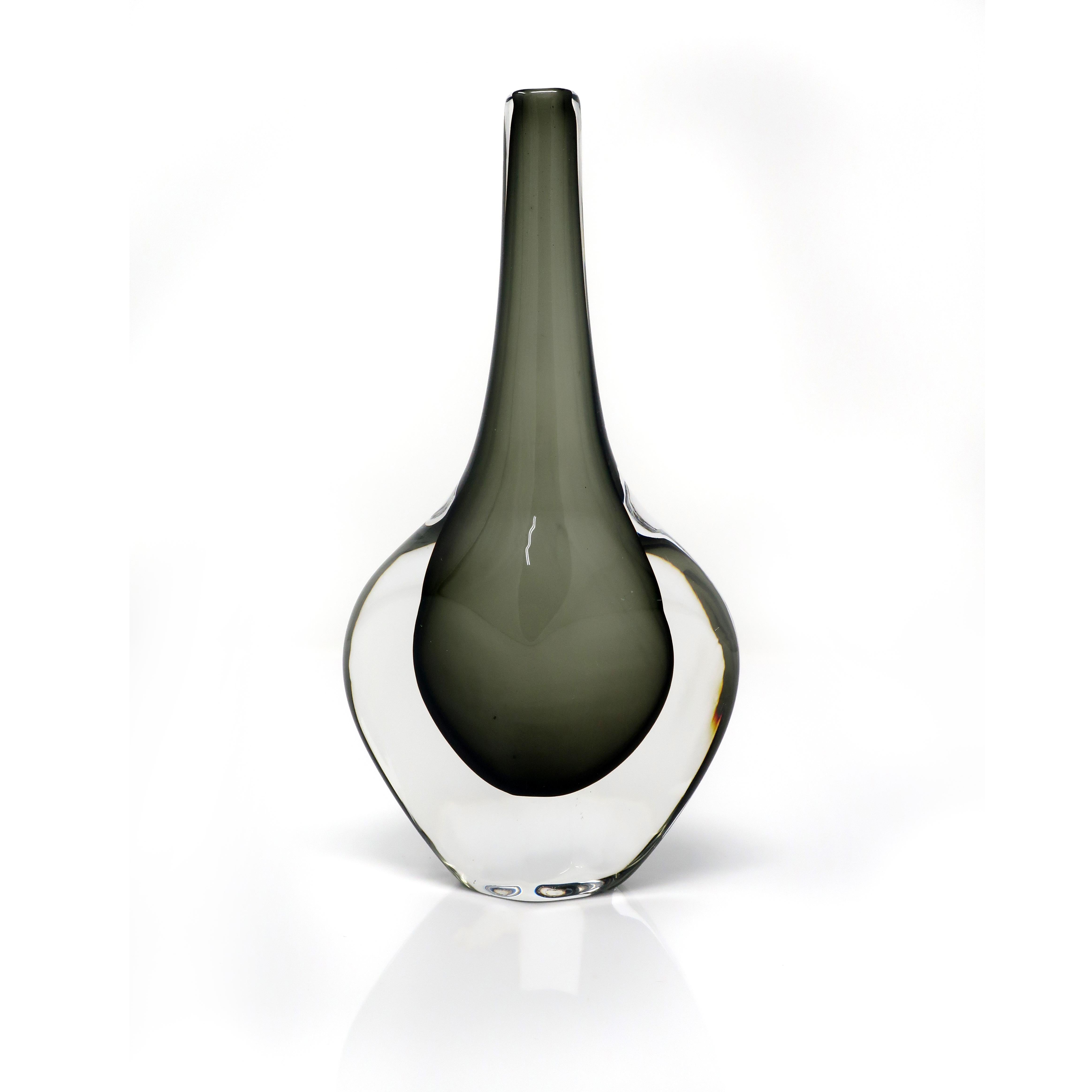A Sommerso glass vase designed by Nils Landberg for Orrefors. Showcases beautifully with a Smokey green interior enveloped by an outer translucent layer that creates an almost floating appearance. Has a perfect slender stem on a wide base.

Signed