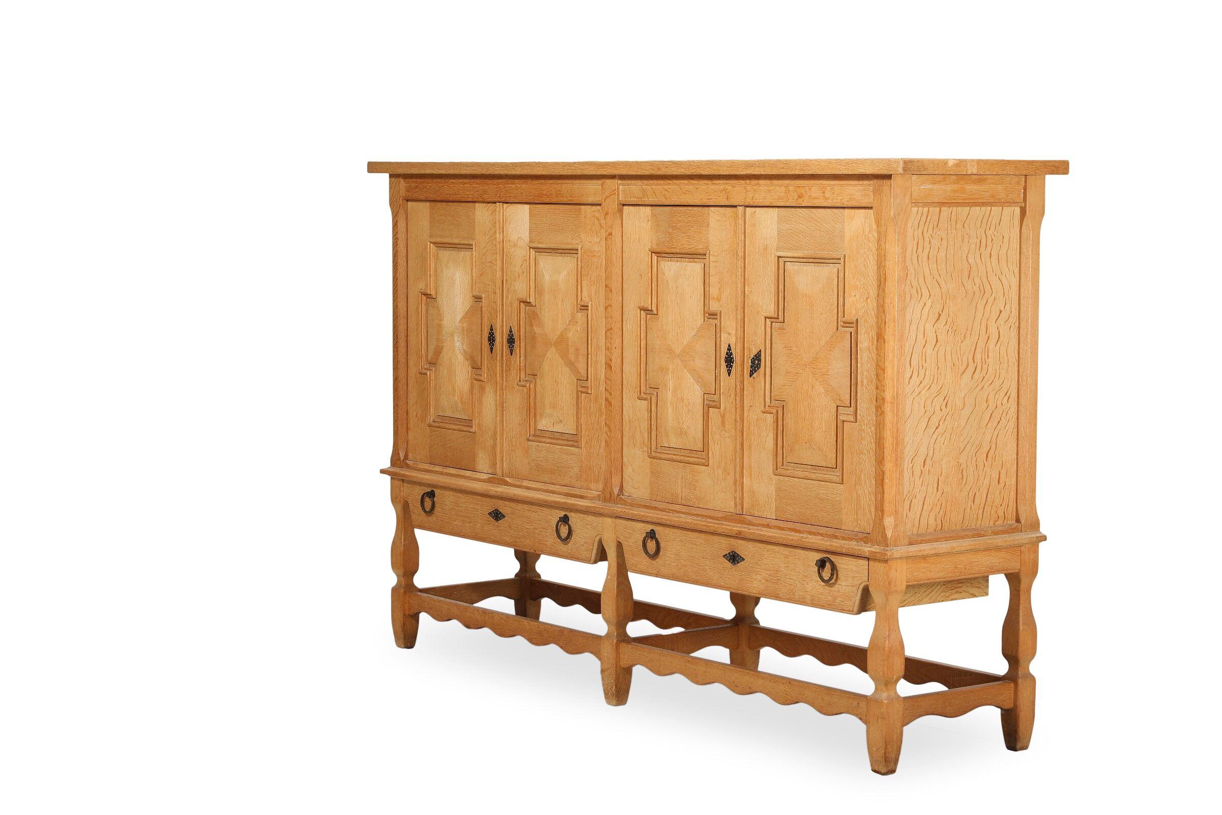 Tall Solid Carved Highboard in Oak by Henning Kjærnulf 1960's For Sale