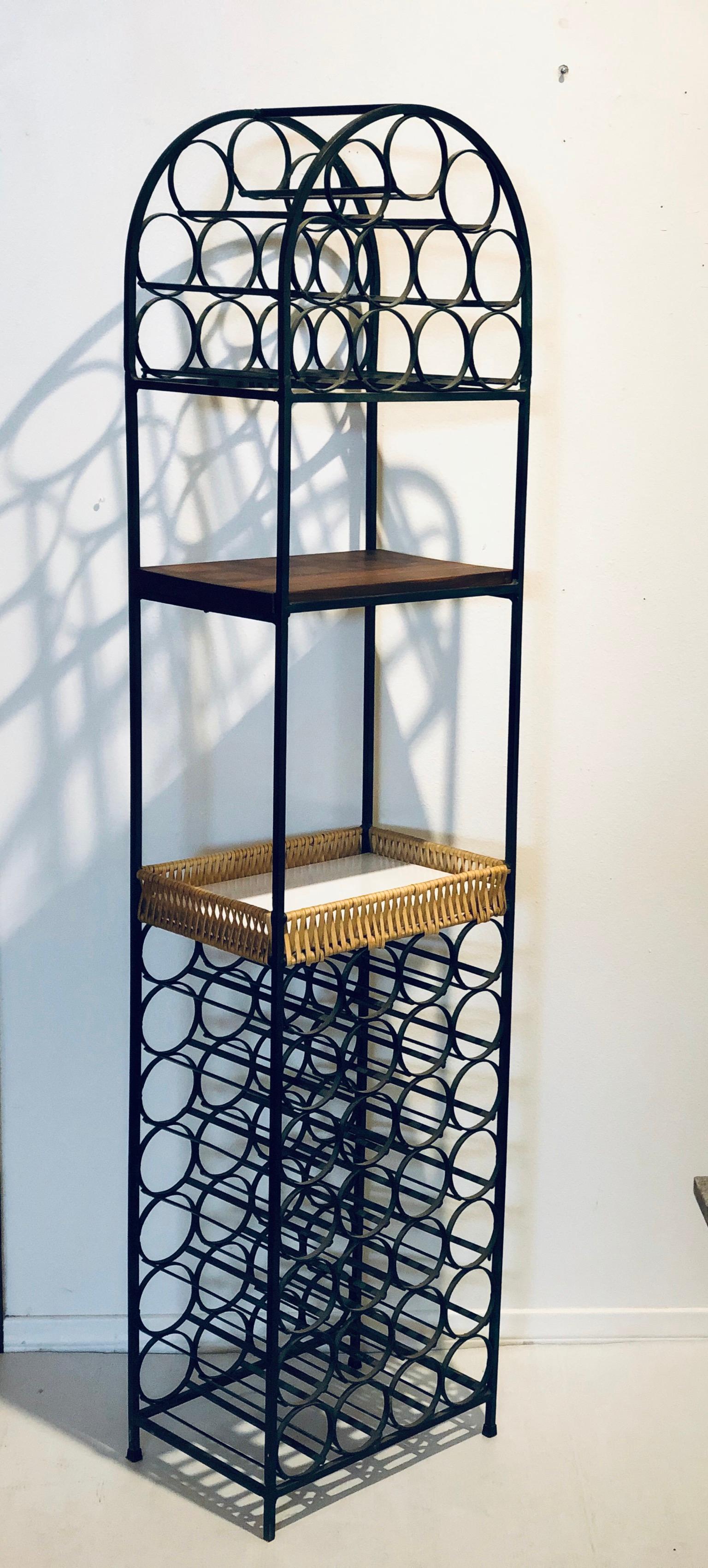 Nice versatile wine rack designed by Arthur Umanoff, with a solid butcher block walnut shelf and basket and iron frame American design.