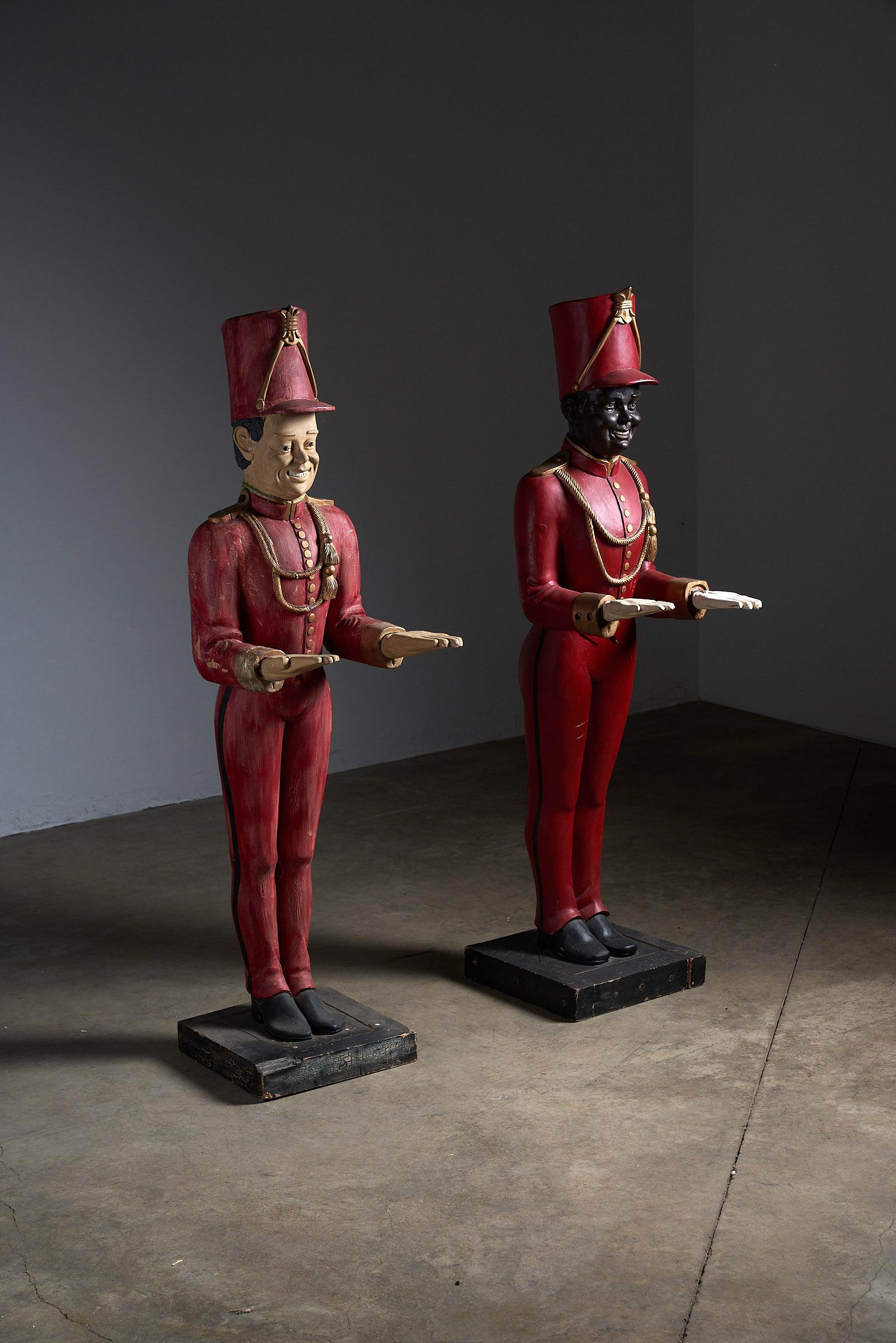 Elevate your decor with this striking antique wooden servant figures, crafted entirely from wood. Dressed in vibrant red clothing and a matching hat, this remarkable piece exudes both charm and craftsmanship. While it stands out as a captivating