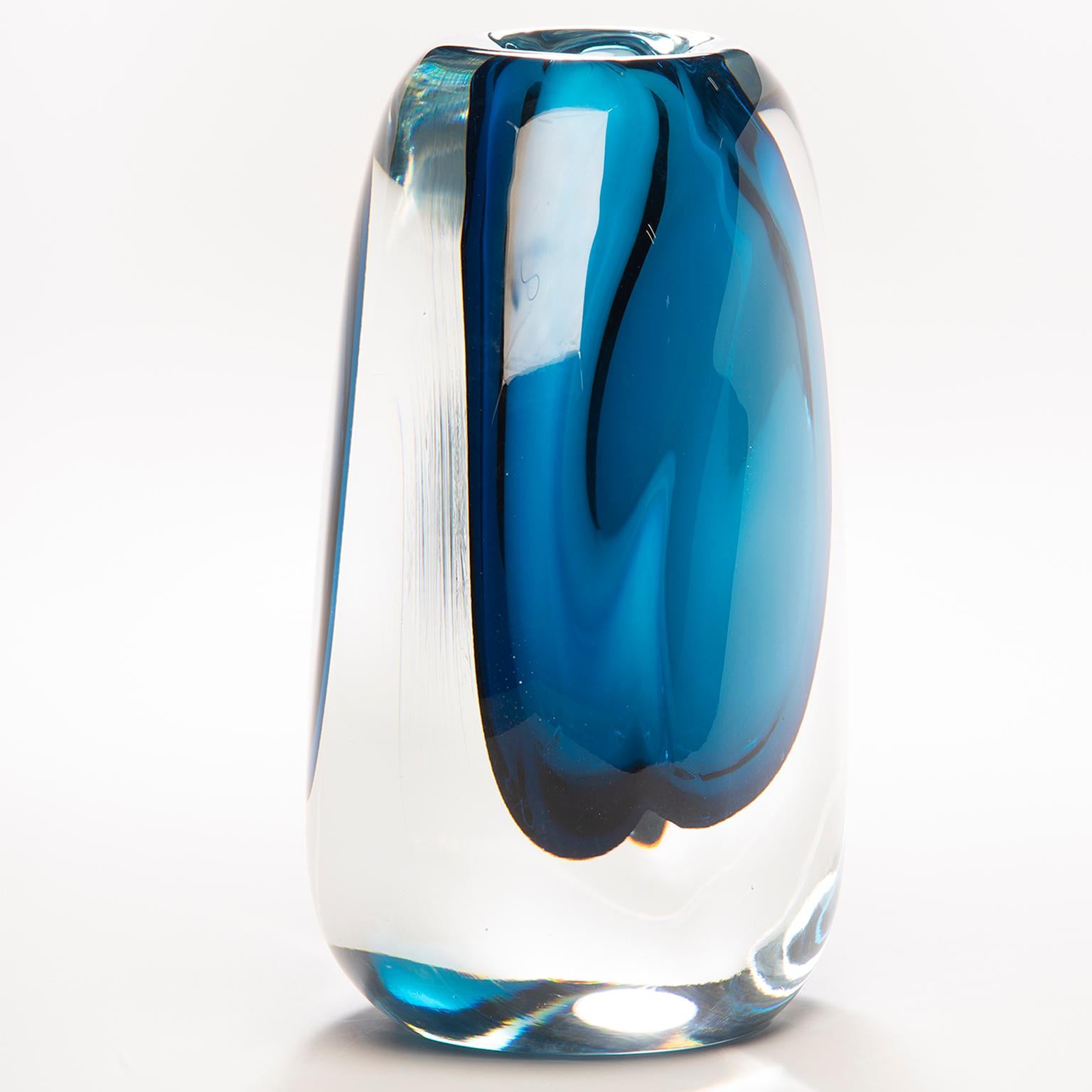 Hand blown in Finland, this Sommerso style tall art glass vase has a heavy, clear cased glass outer layer and blue colored core. New with no flaws found.