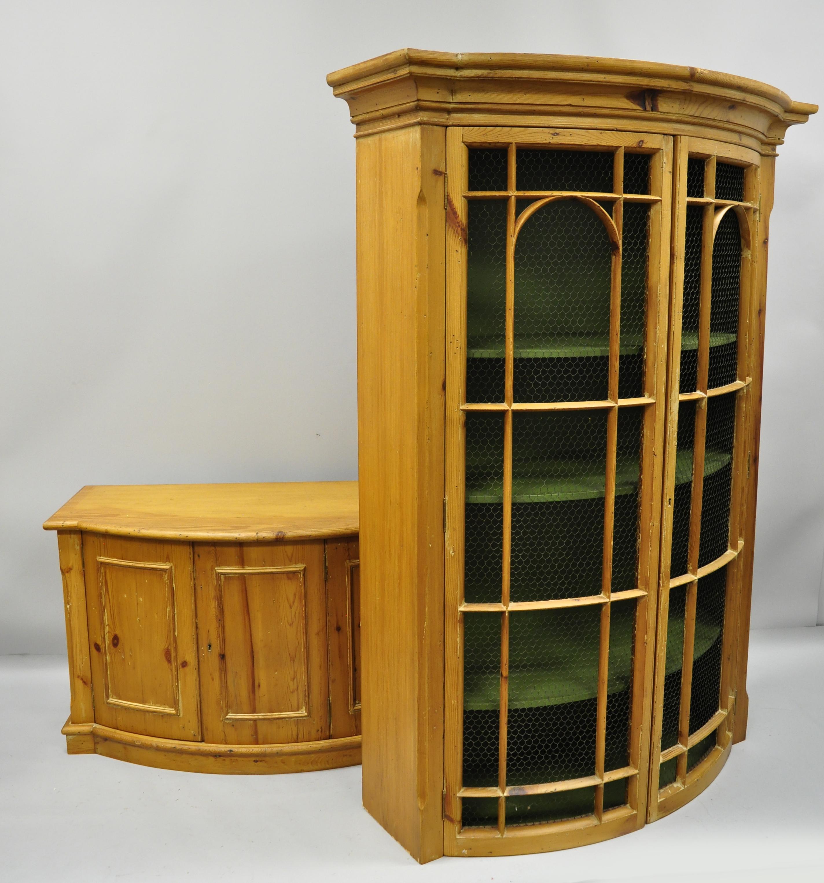 Tall Spanish bookcase cabinet. Item features green painted interior, two swing doors with metal wire lattice, and lower swing cabinet doors, circa mid-20th century. Measurements: 87