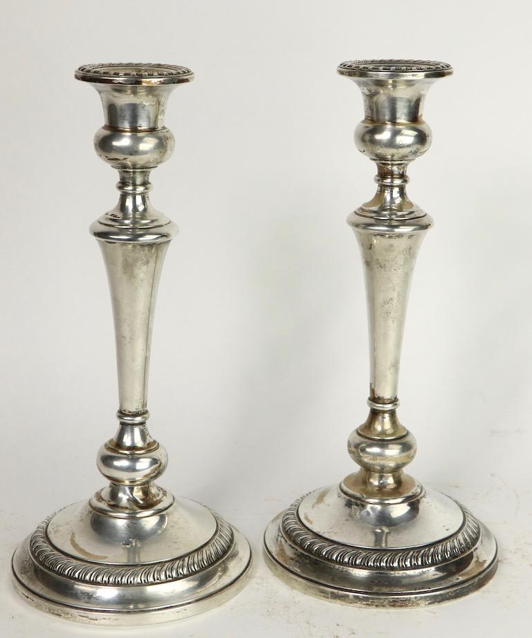 Elegant classical sterling candlesticks by Preisner. The candlesticks are in very good original condition showing some tarnish and inconsequential creasing at base ( pictured ), they are weighted, both are signed. 2.5 inch diameter at top x 5.25