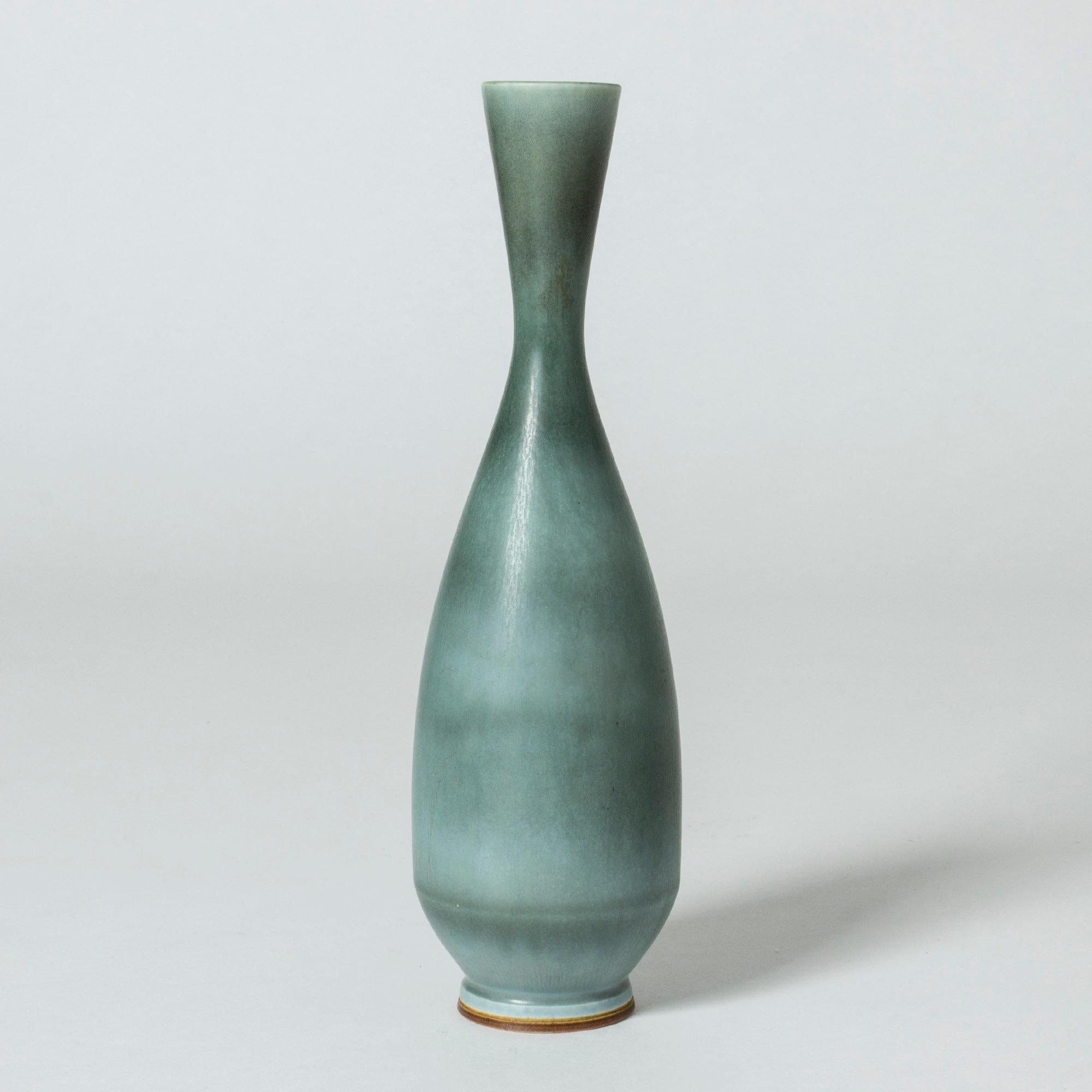 Beautiful stoneware vase by Berndt Friberg with ocean blue glaze with variation between dark and lighter hues.