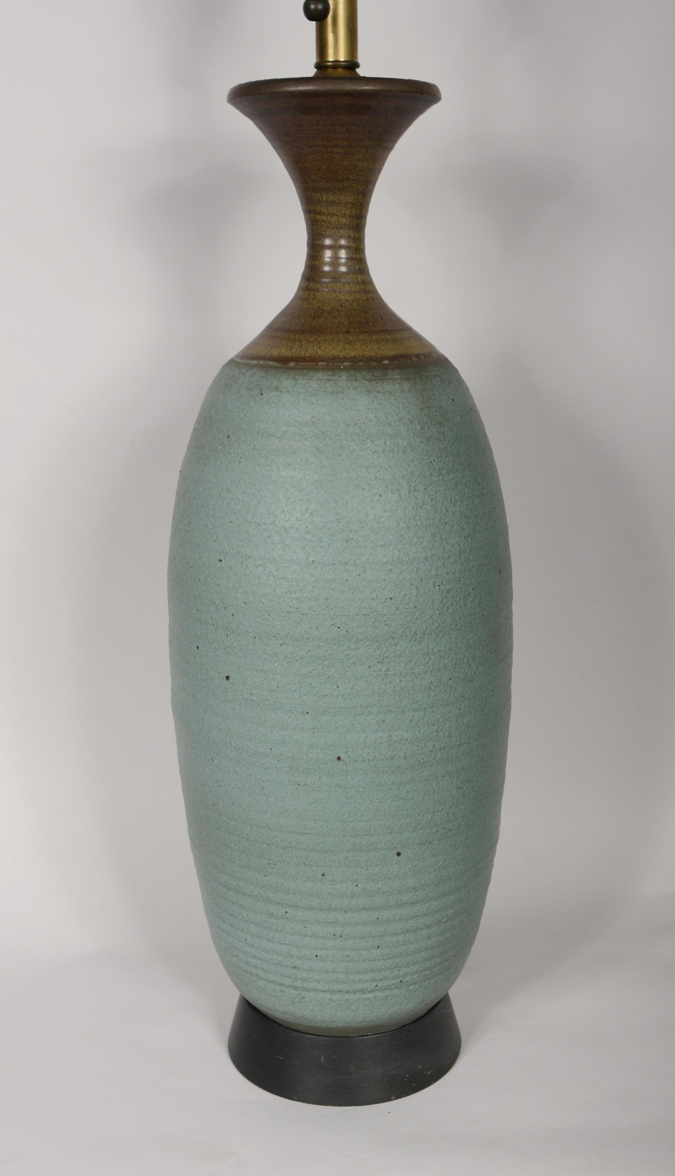 Hand thrown ceramic lamp by Bob Kinzie for Affiliated Craftsmen. This lamp has an outstanding form with great color combination. The lamp is the tallest version of this style measuring 28 inches to the base of the socket.