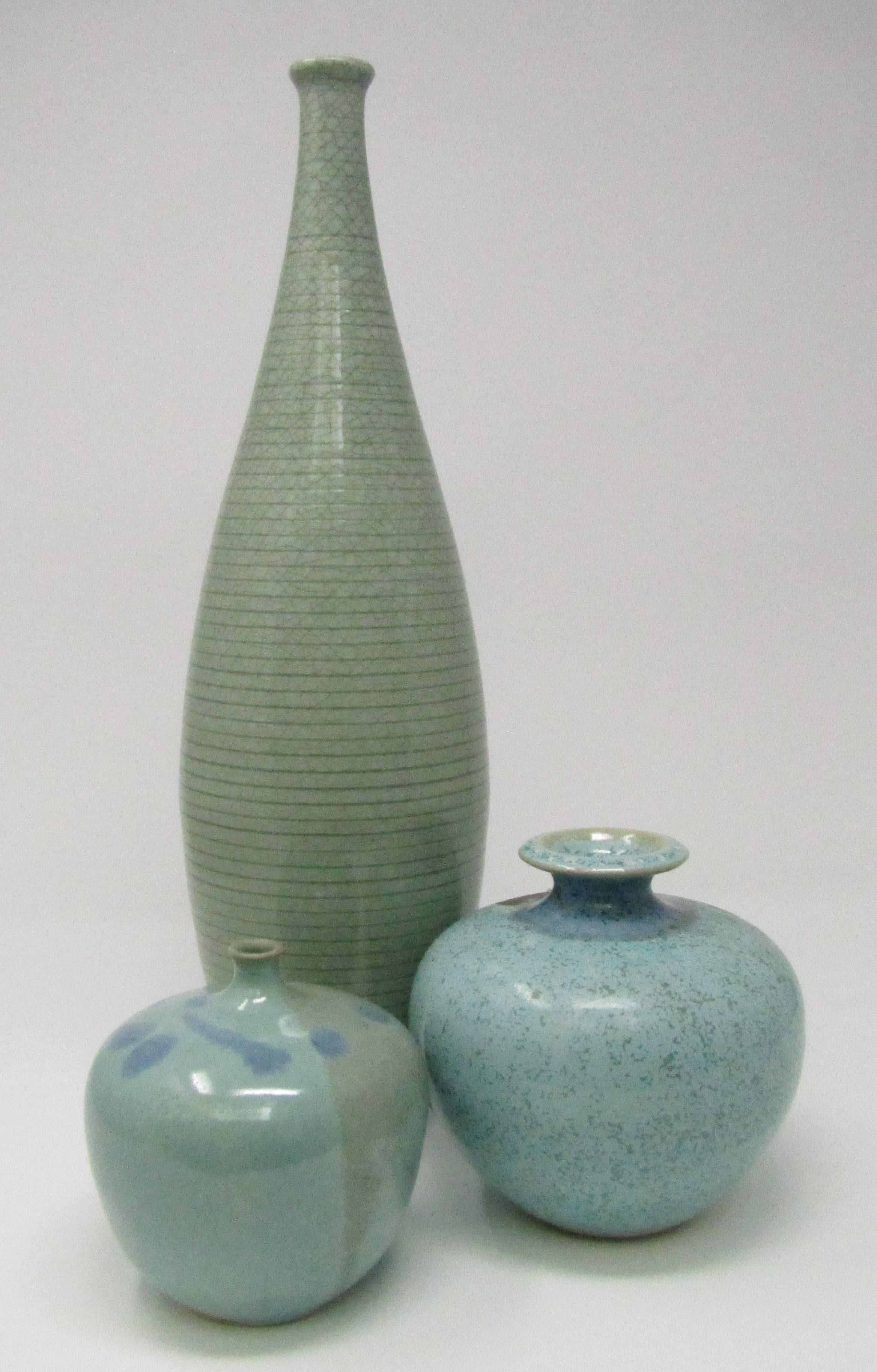 A sleek, tall, ribbed, crackle glazed celadon ceramic bottle vase
Impressed SL Sweden, X on the base
Swedish, circa 1950.