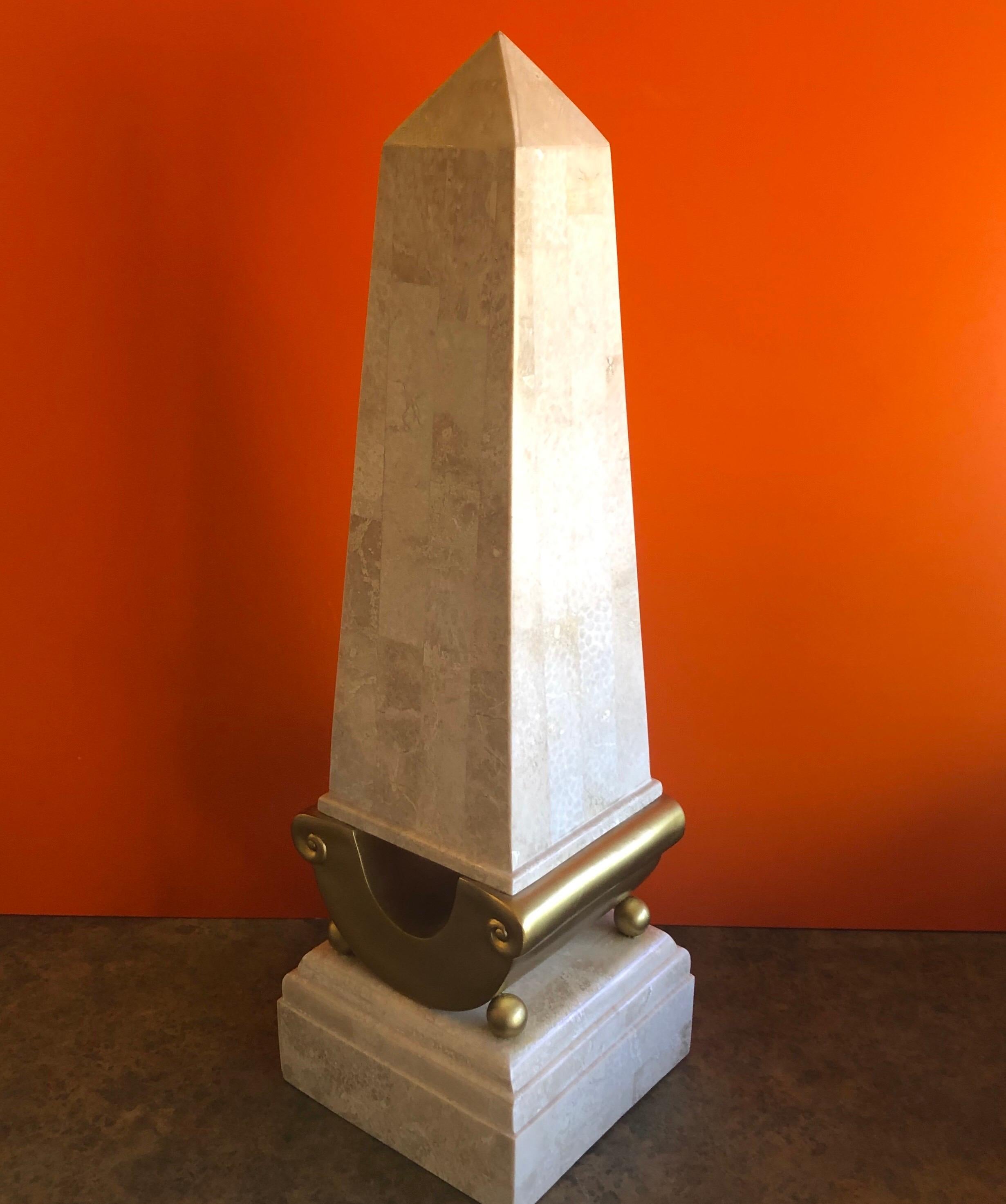 Tall tessellated stone obelisk on a gold stand in the style of Marquis Collection of Beverly Hills, circa 1980s. The piece was made in the Philippines and measures: 9.125