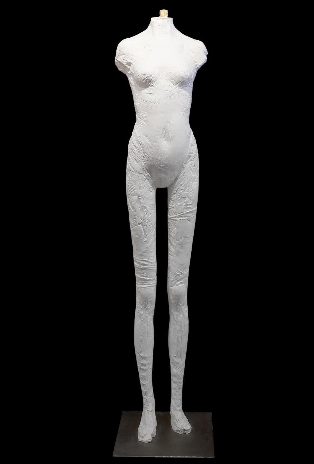 Modeled in th style of Manuel Neri (American 1930-2021) this figure with exaggerated long legs is in some ways reminiscent of works by Giacometti. Standing 7 feet tall the sculpture adds a new dimension to its Surroundings giving the viewer a sense