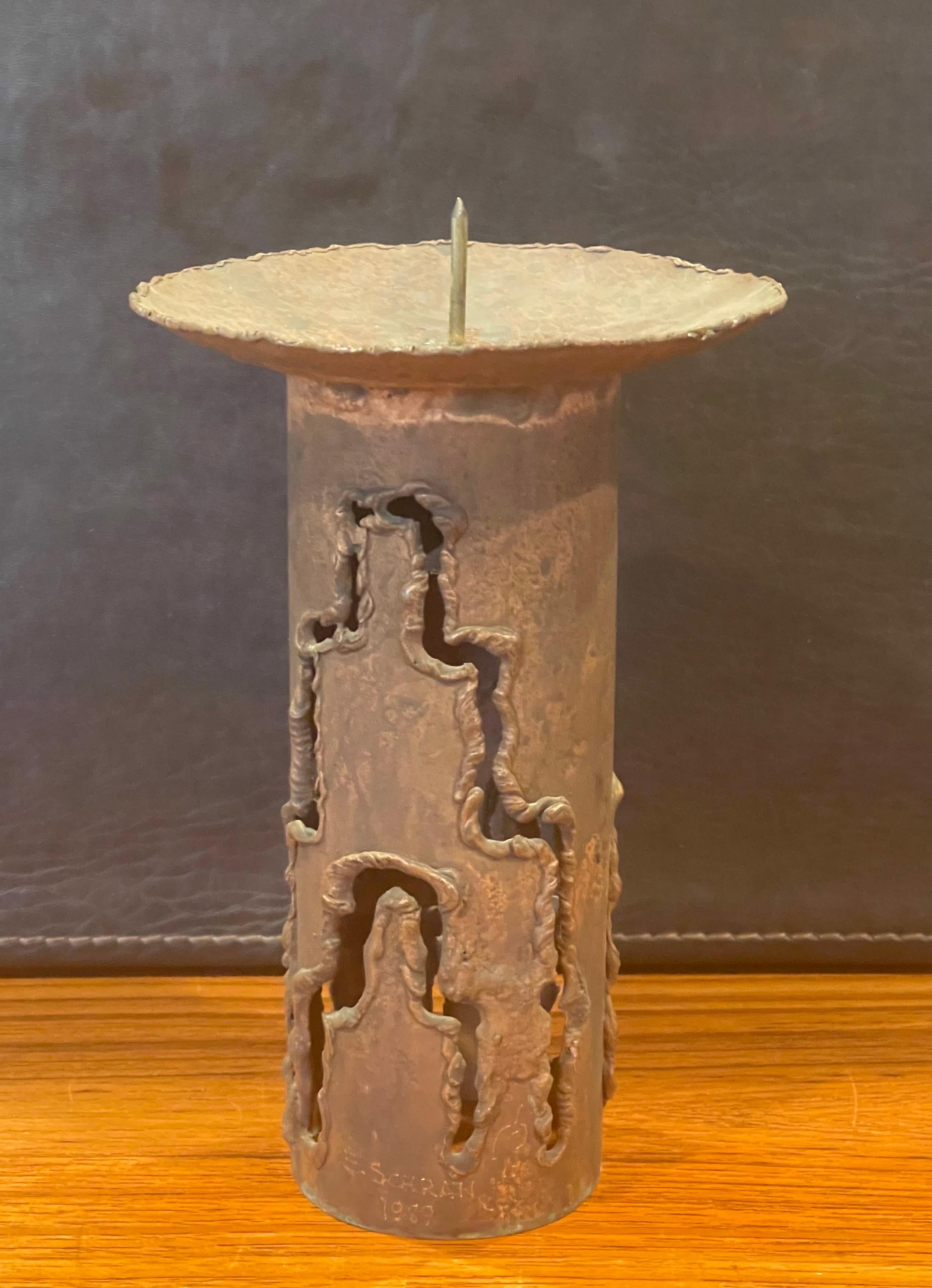 Tall torch cut brutalist copper candleholder by E.Schran, circa 1989. The piece is in very good vintage condition and measures 5.25
