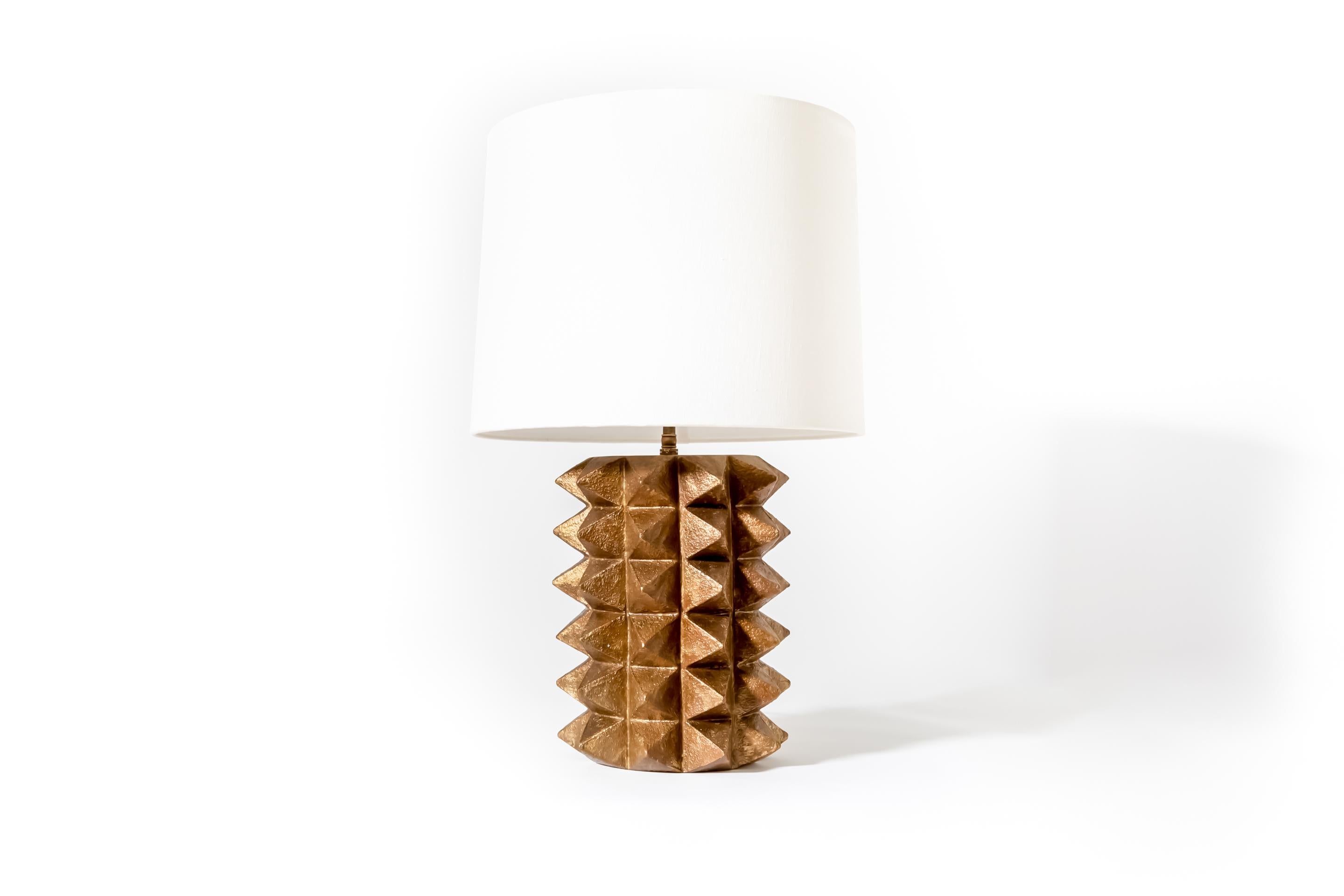 Illuminate your space with sophisticated radiance through our exceptional Toria Table Lamp, where artisanal craftsmanship meets contemporary luxury lighting design. The Toria Table Lamp embodies refined elegance with its perfectly balanced